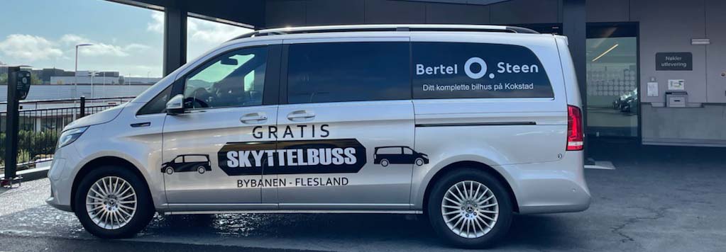 Grå gratis skyttelbuss.