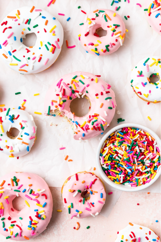 Several donuts with sprinkles.