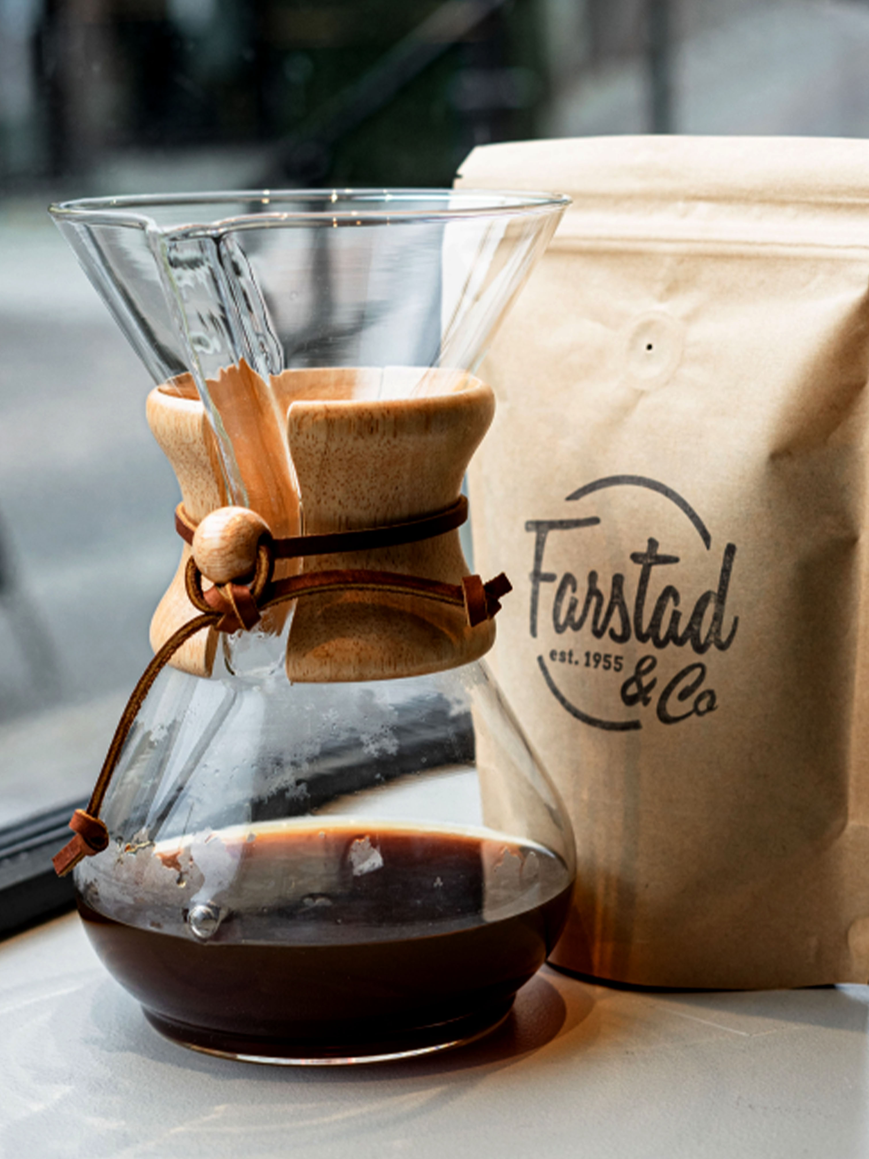 Chemex with coffee and coffee bag in the background