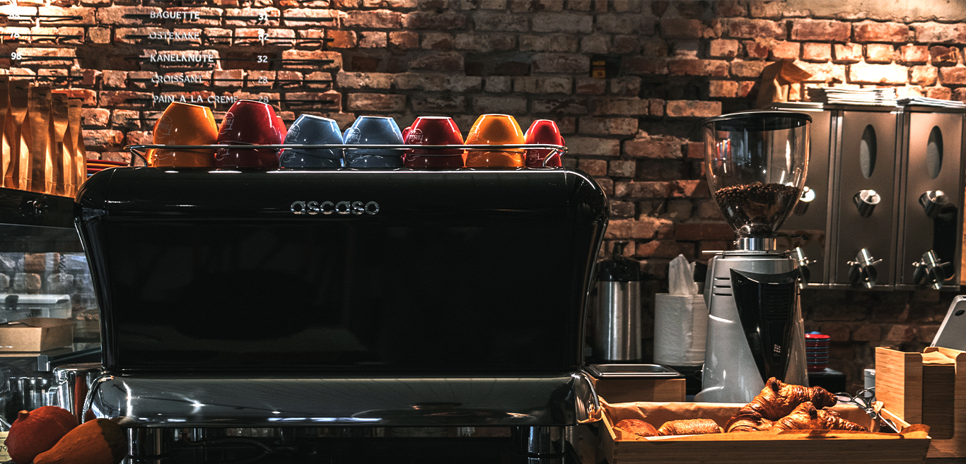 Barista coffee maker and bar with food and coffee supplies