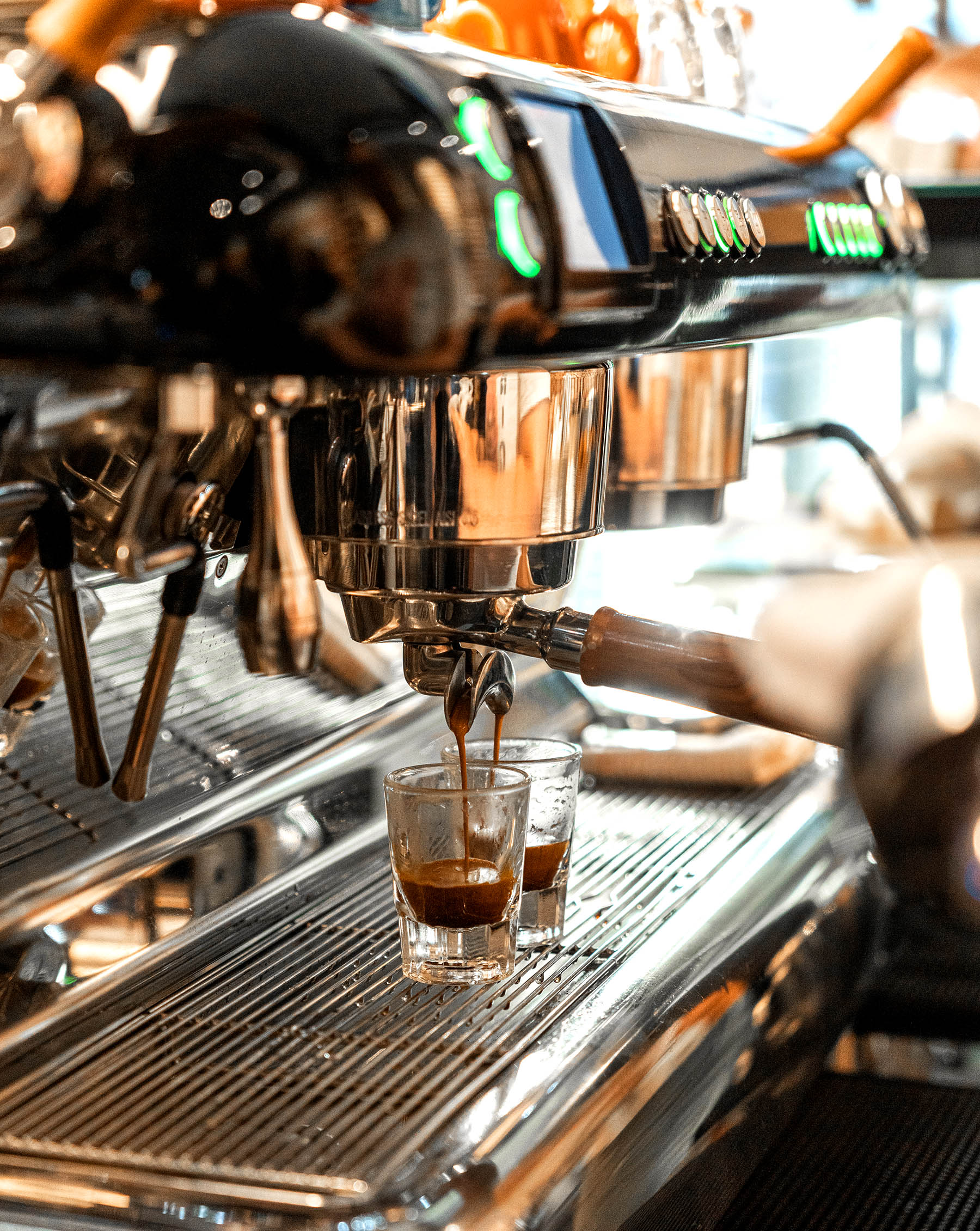 Making two espressos on a barista coffee machine