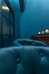 A cozy room with cyan walls and wood details
