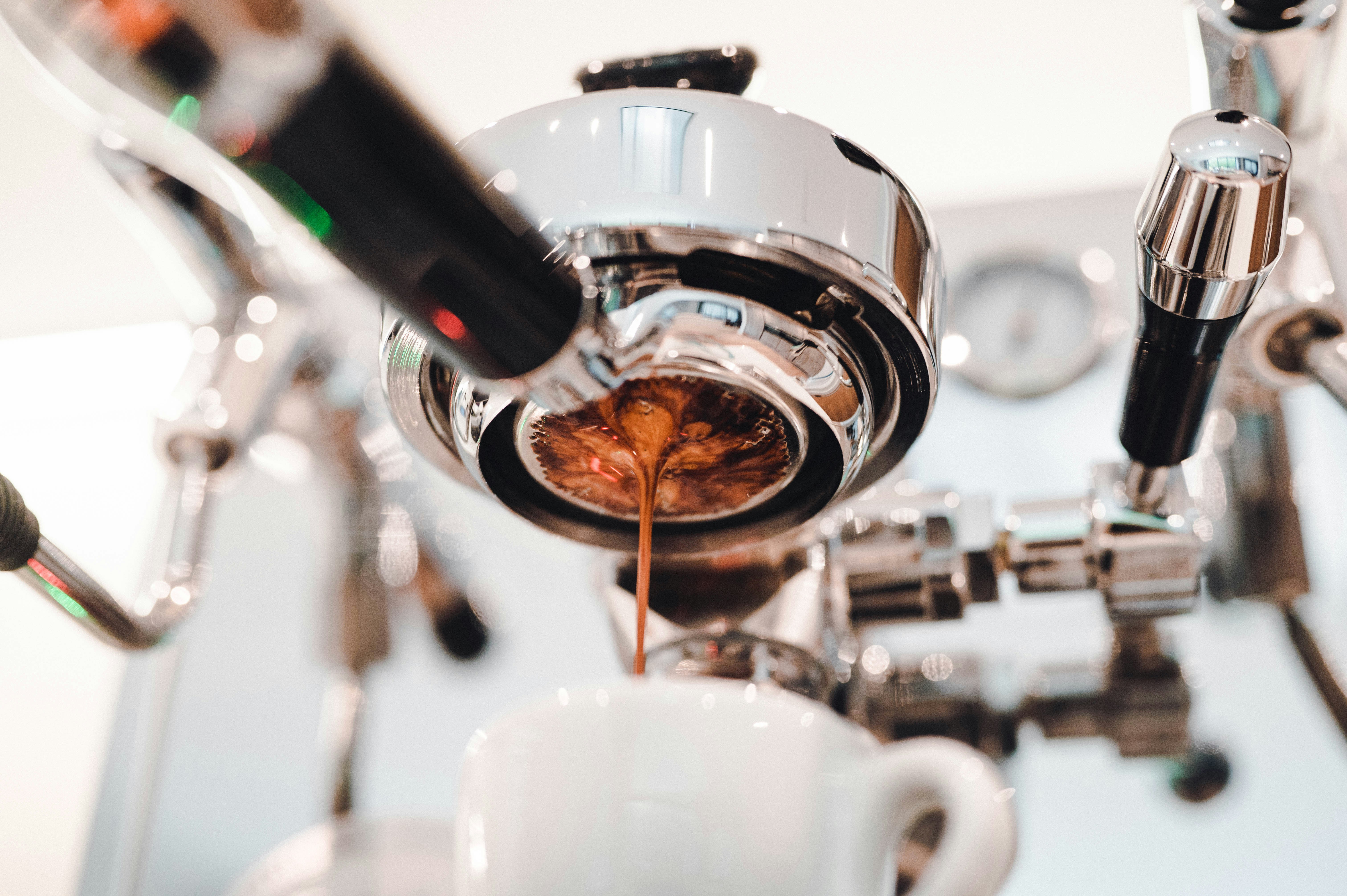 Coffee dripping into a mug.