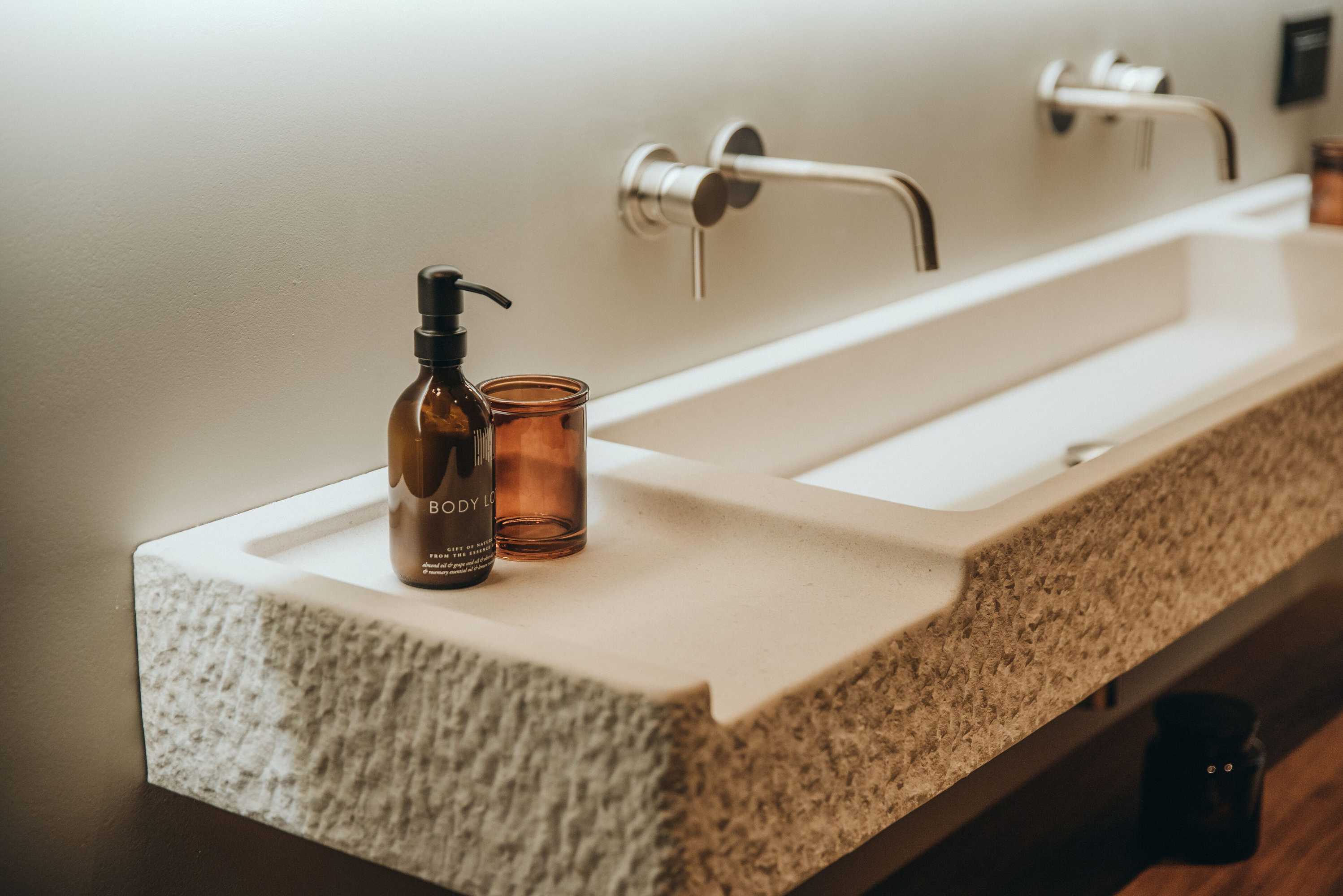 Kuishi branded soap dispenser in bathroom