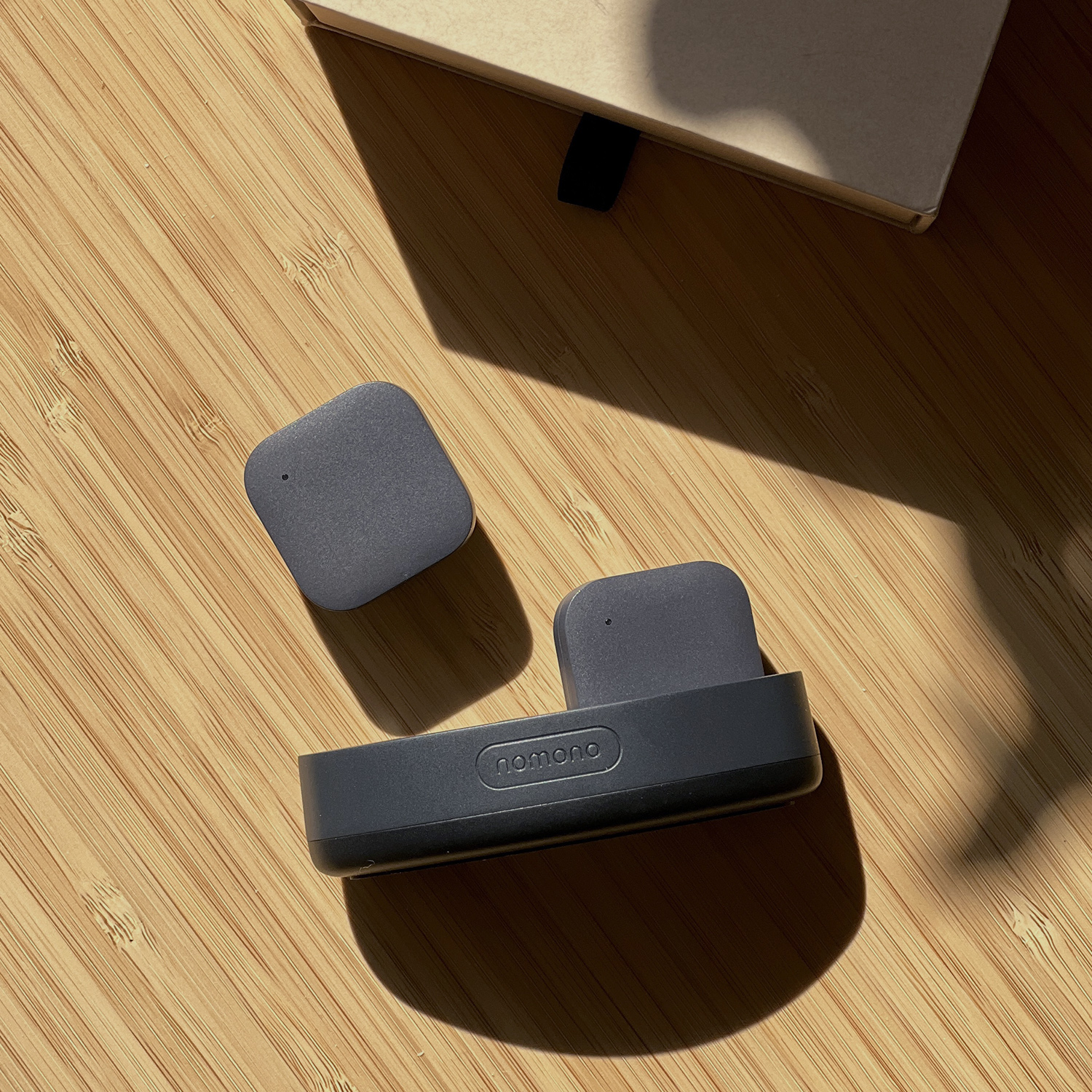 Stellar Kit on table showing two mics and charging dock