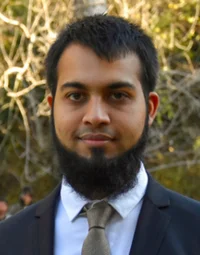Portrait of Mohammad Mudassir Rafiq, CEO of Smartify, wearing a suit and standing outdoors.