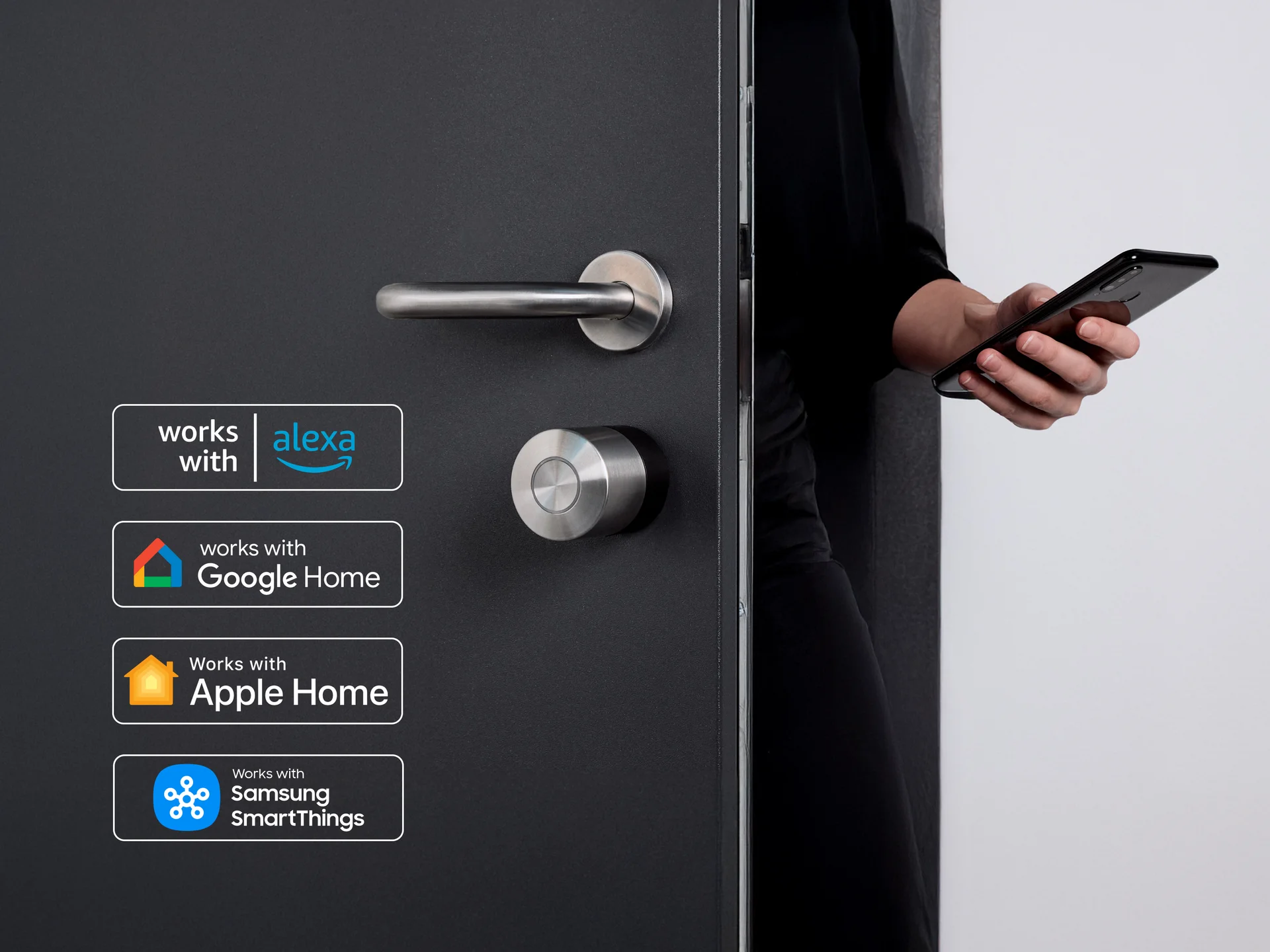 Person unlocking a dark-colored door using smartphone with Nuki Smart Lock and smart home compatibility logos