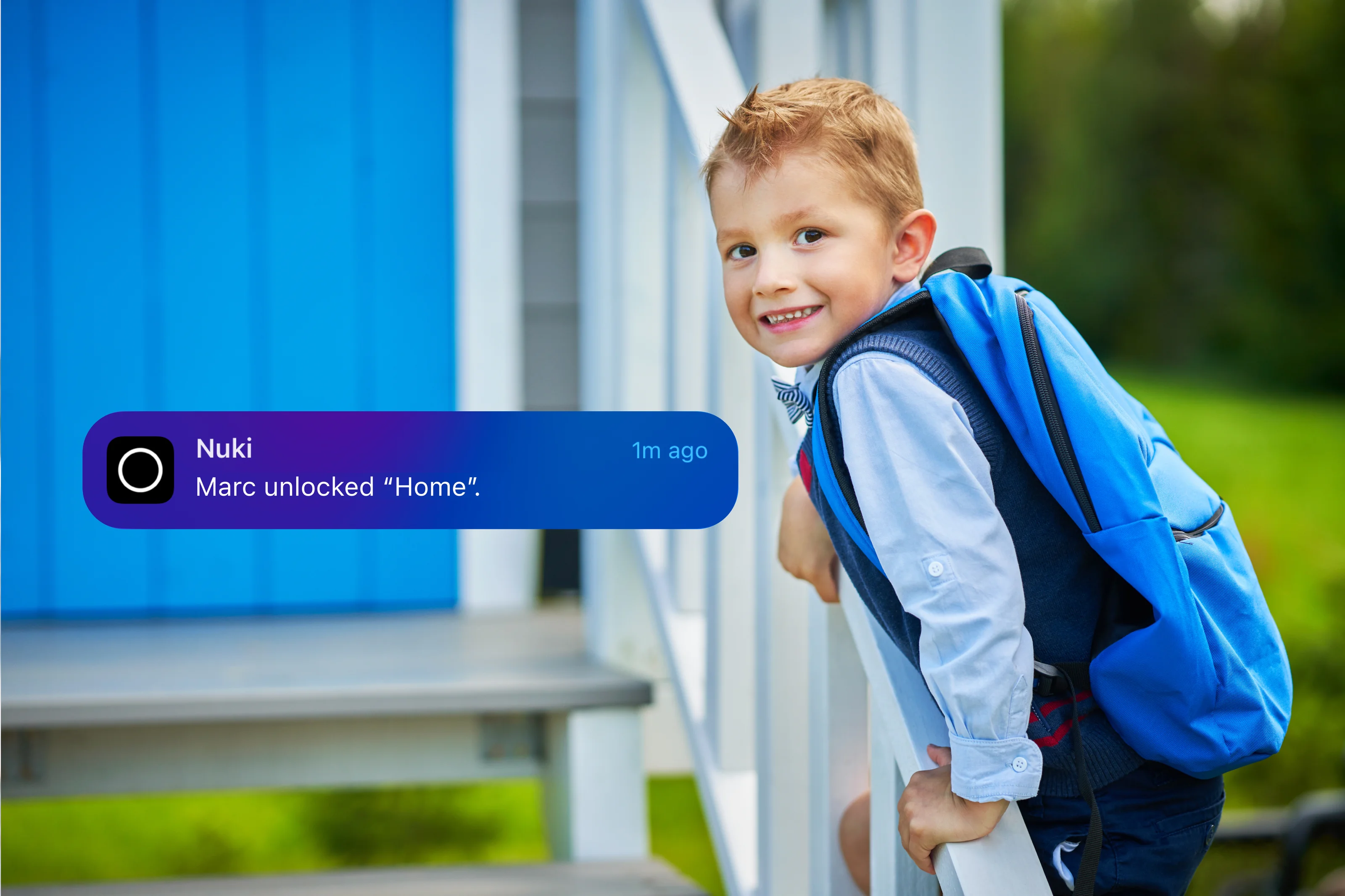 Smiling young boy with a blue backpack on stairs, and a Nuki smart lock notification.