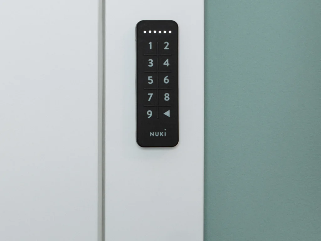 Nuki Keypad mounted to a white door frame
