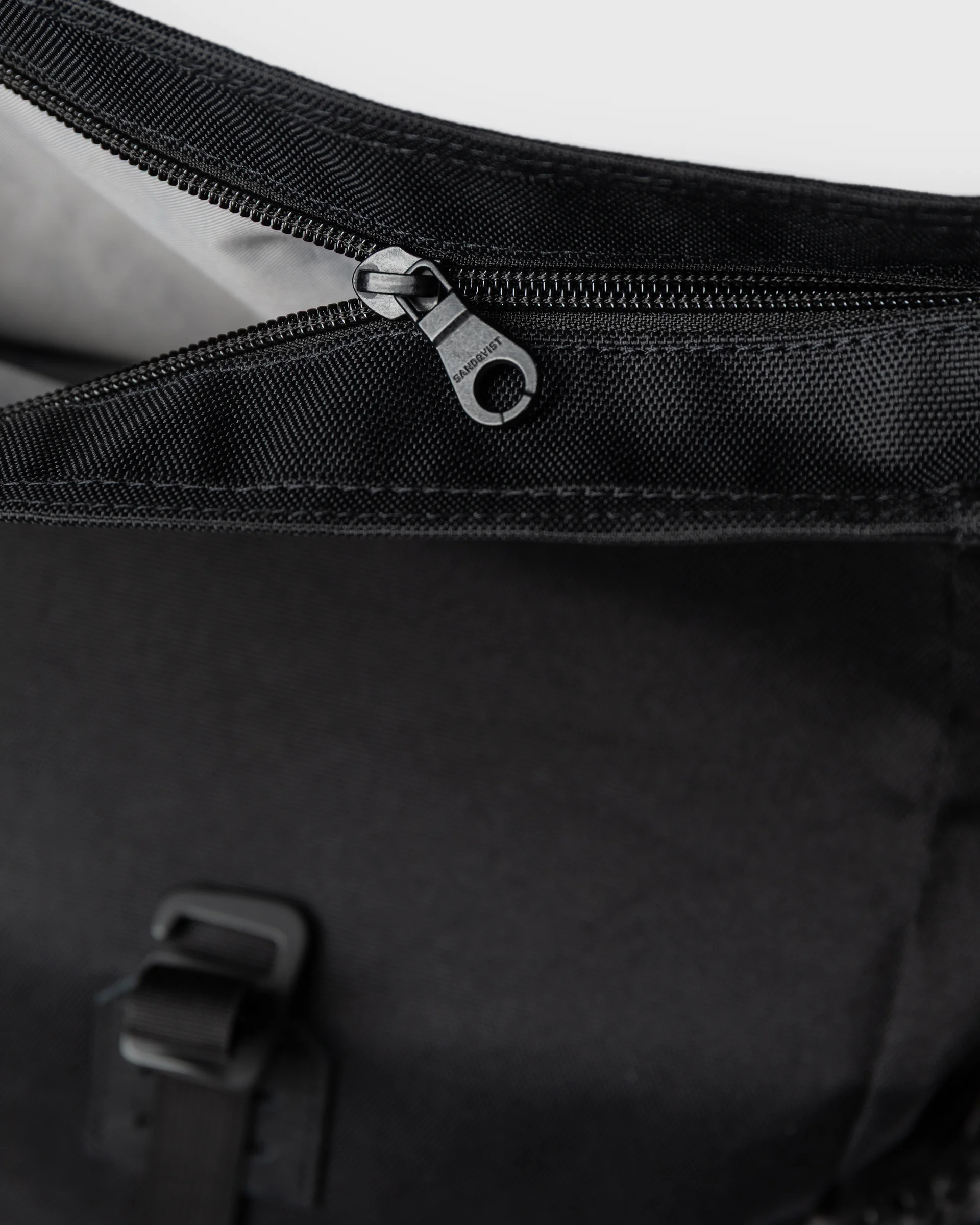 Zipper closure for main compartment on Sandqvist backpack ICON Rolltop Backpack M in Black