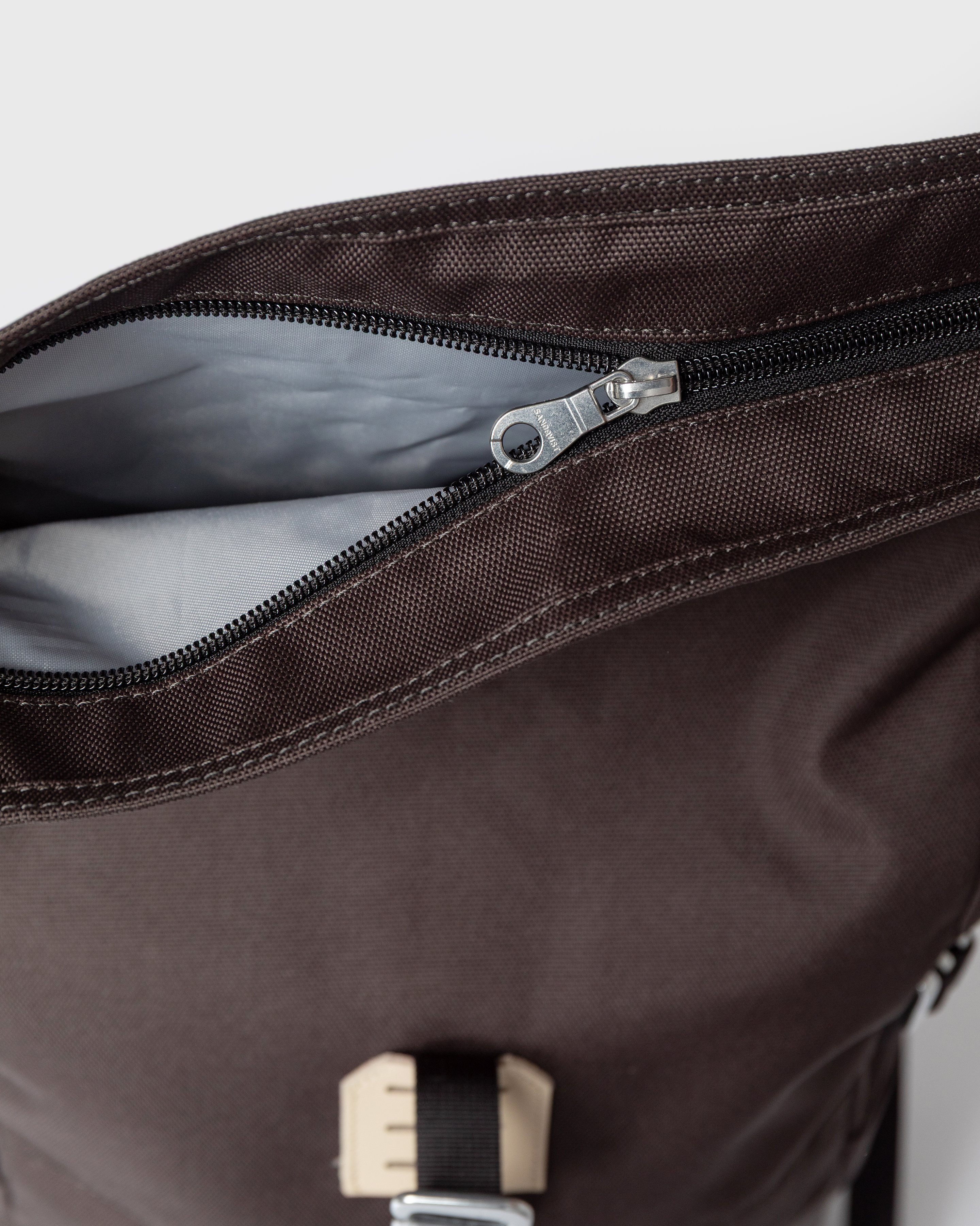 Zipper closure for main compartment on Sandqvist backpack ICON Rolltop Backpack M in Brown