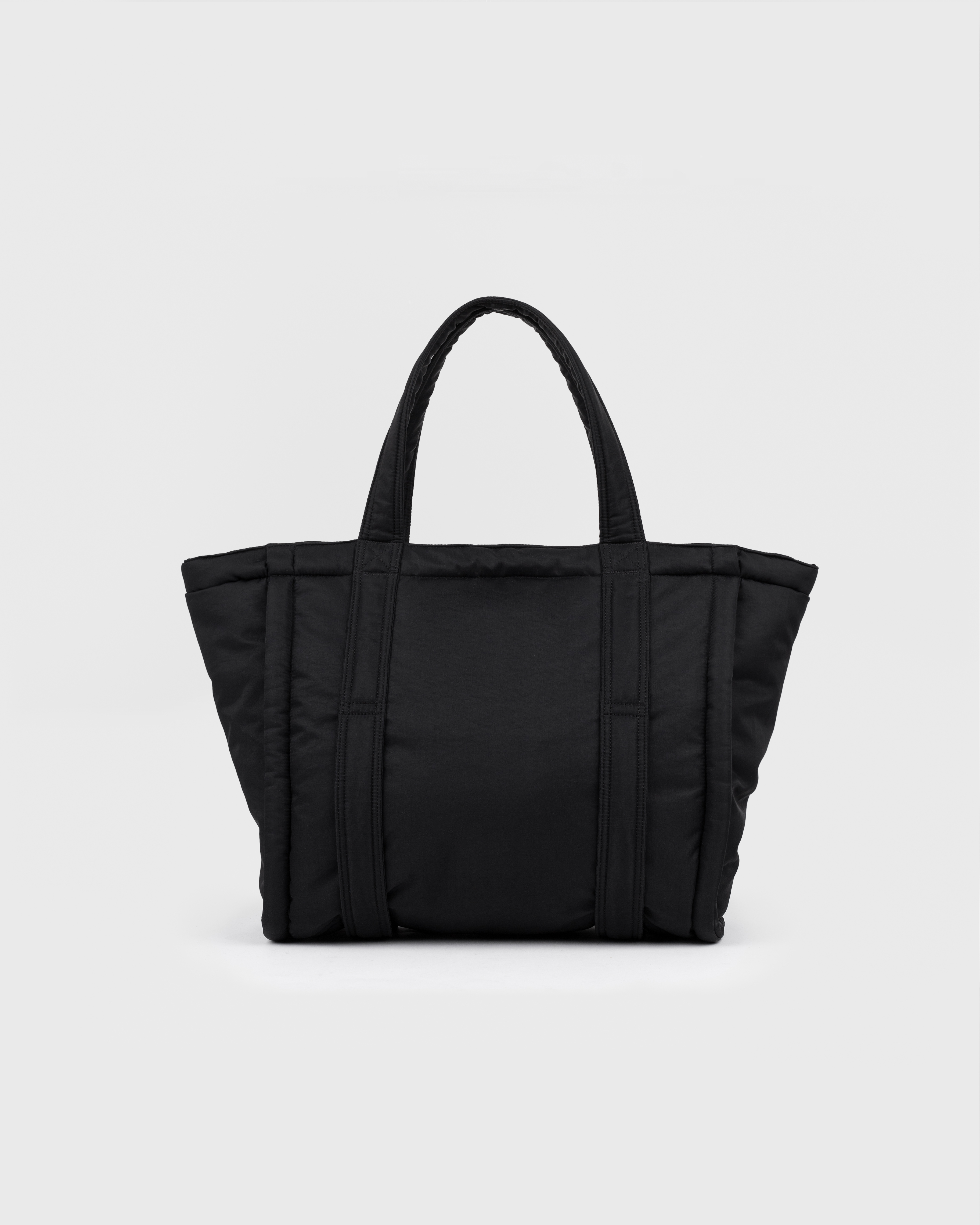 Sandqvist Curve Tote Bag, black. Back view with handles.