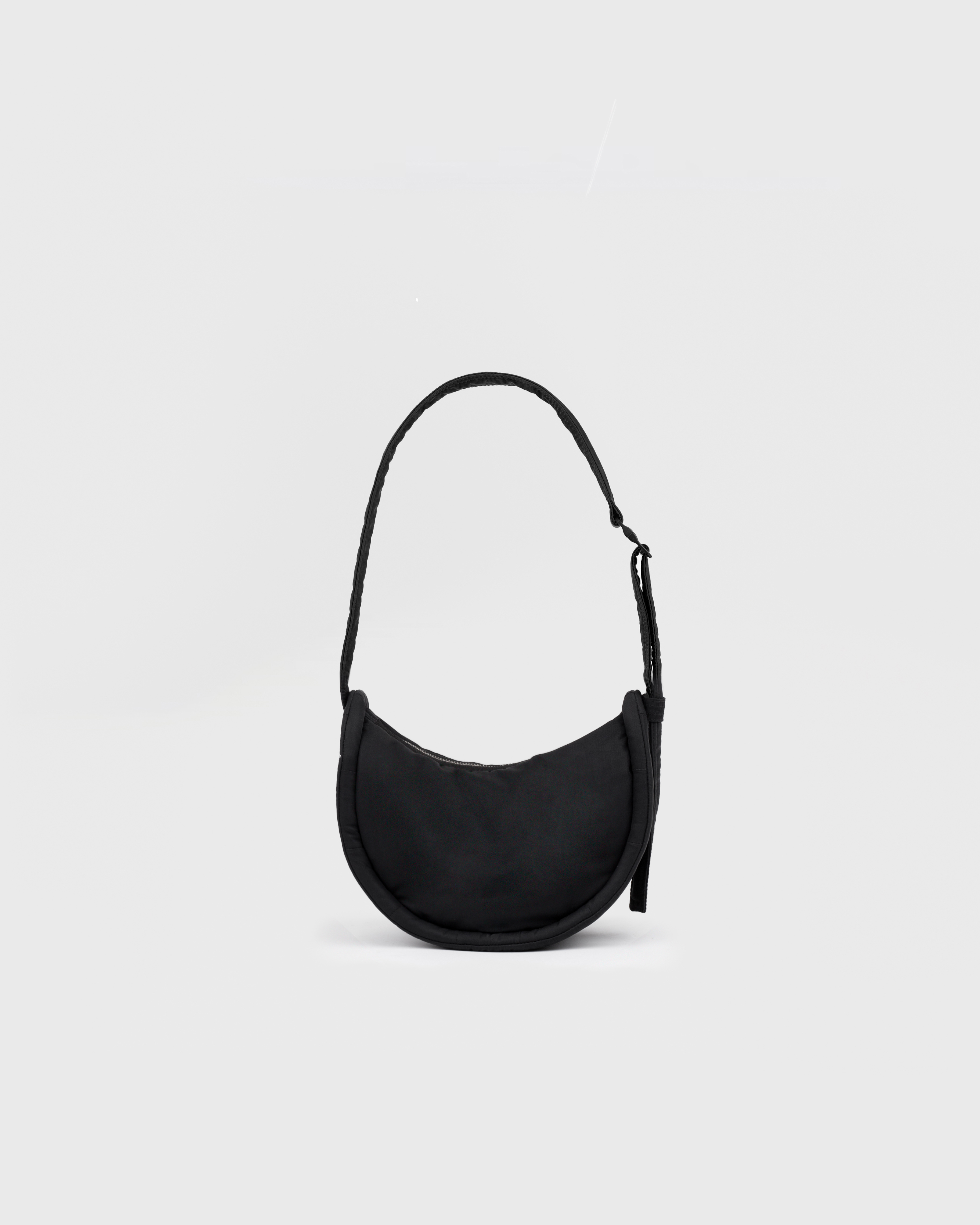 Handbag. Sandqvist Curve Half Moon Bag Mini, black. Back view with shoulder strap.