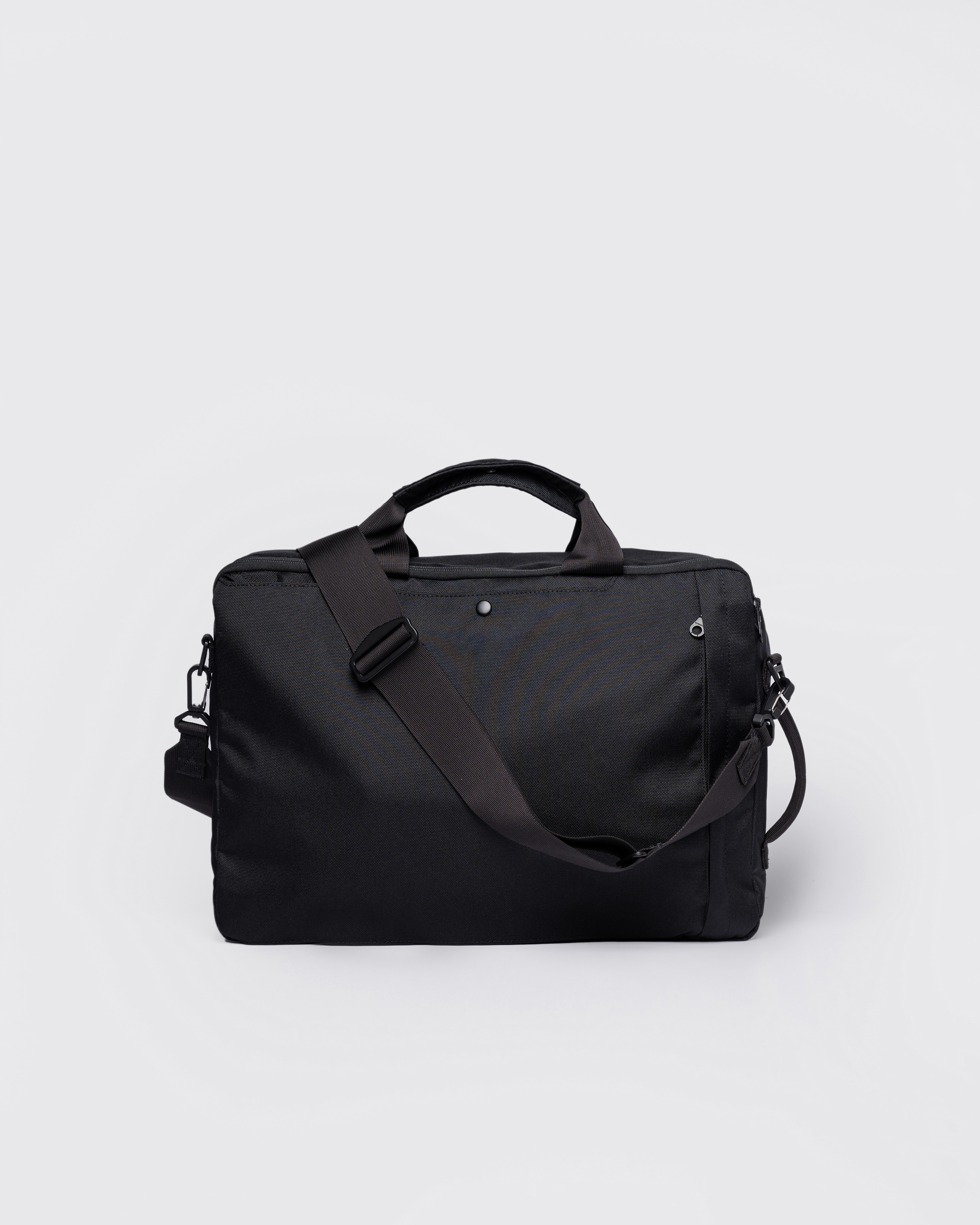 GO 3-Way Bag M, black. Back view, handles and adjustable shoulderstrap.