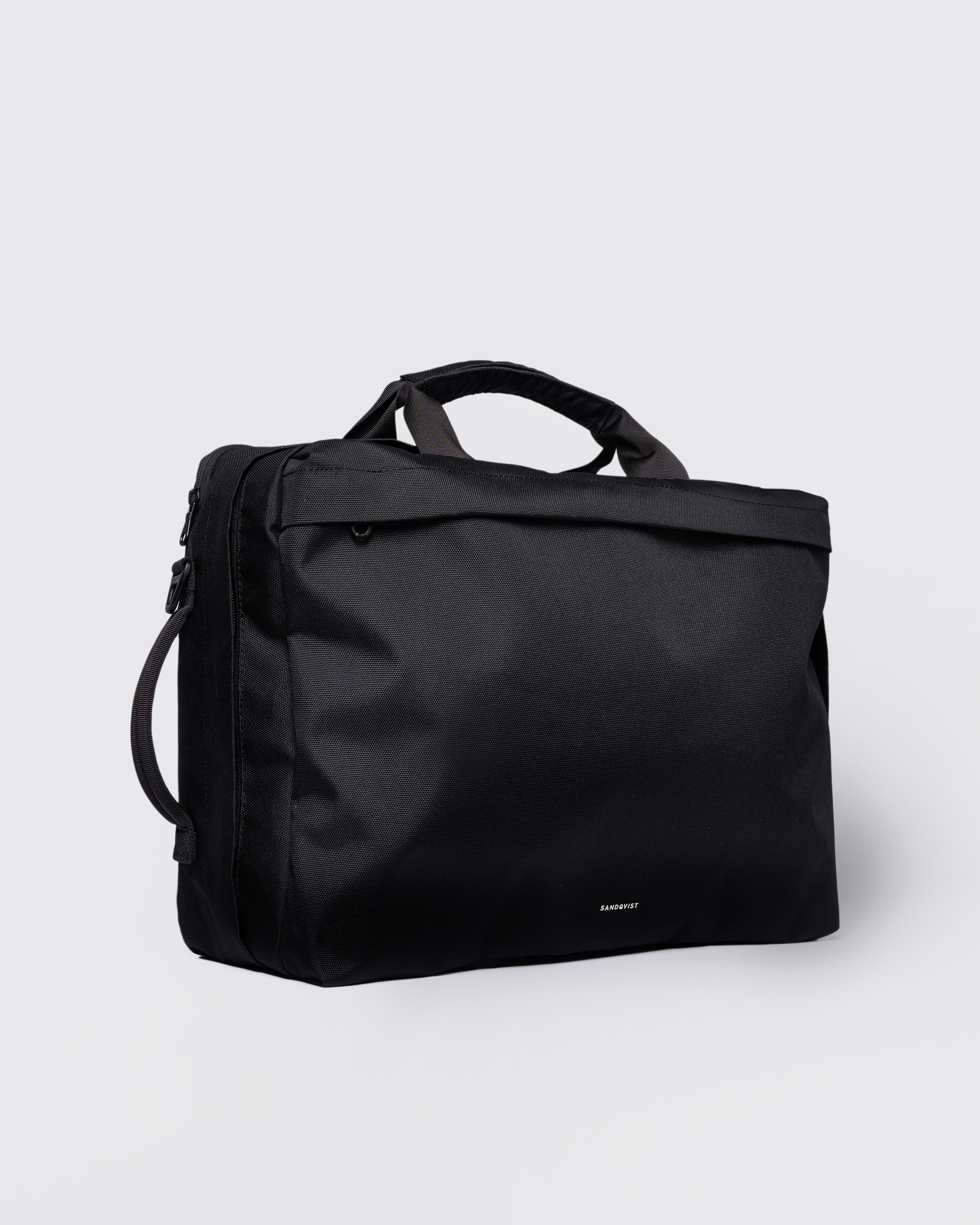 GO 3-Way Bag M, black. Front view, two top-handles and one on the side.