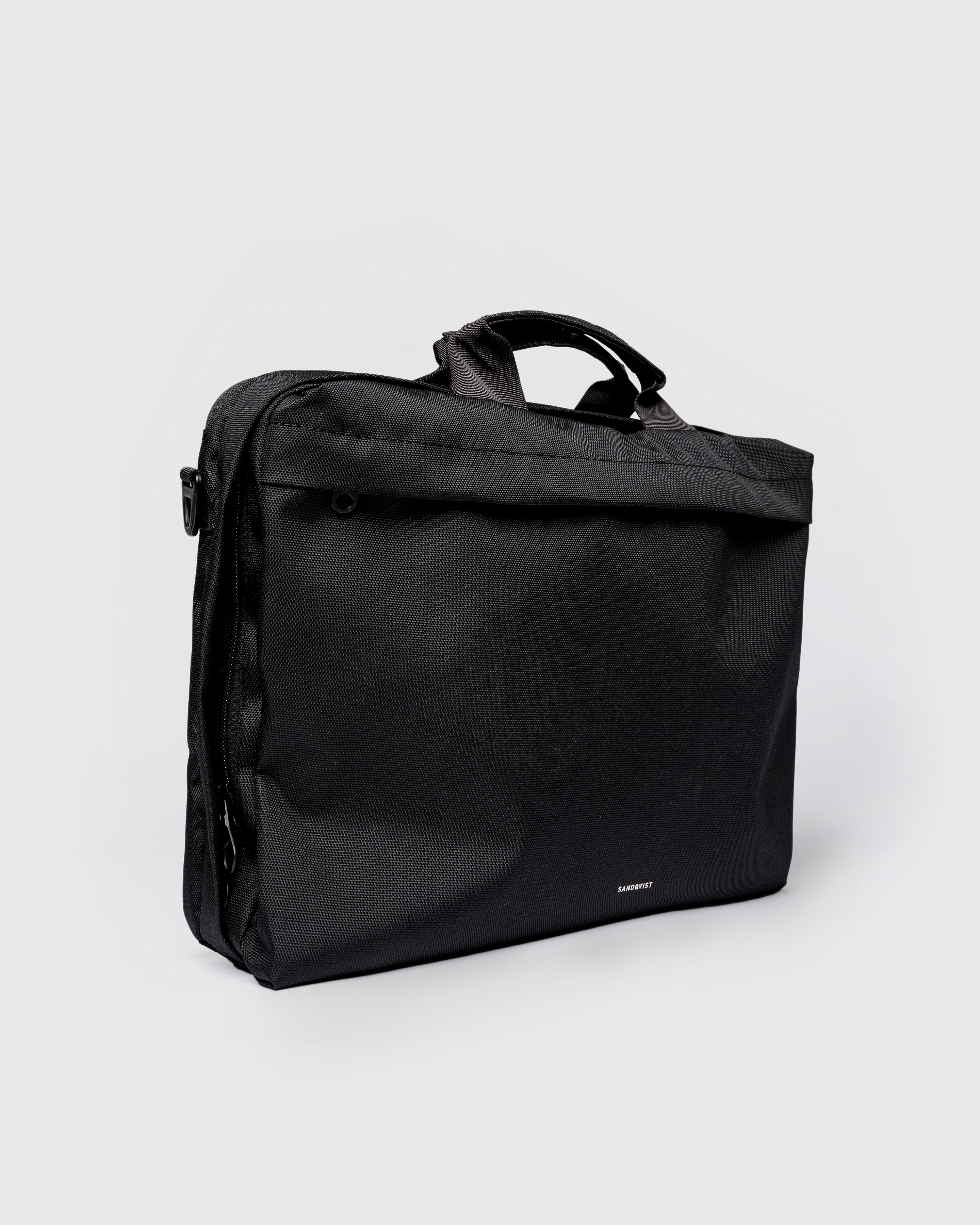GO Briefcase, black. Front view, two handles and front pocket with zipper.