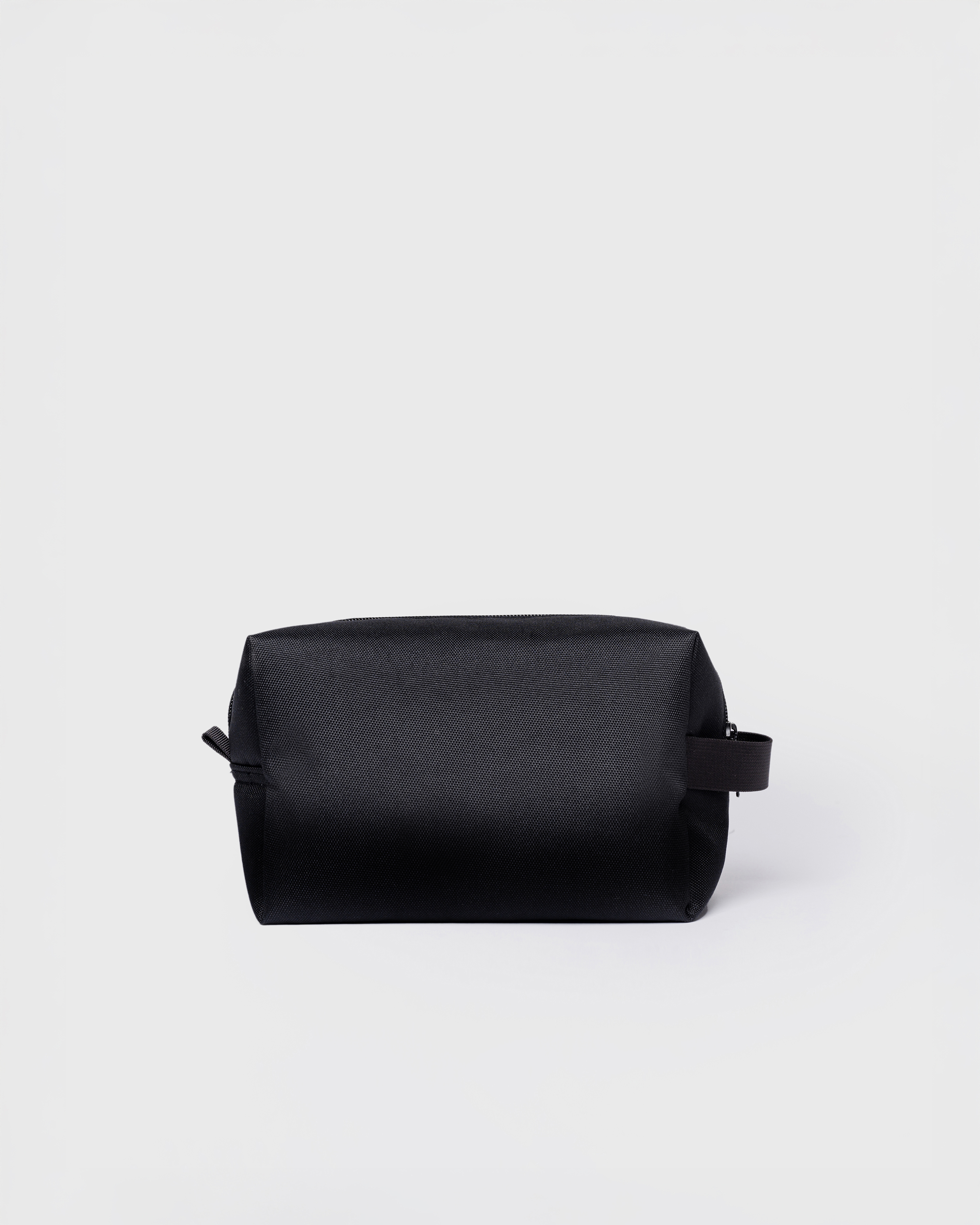 GO Handle Wash Bag, black. Back view.