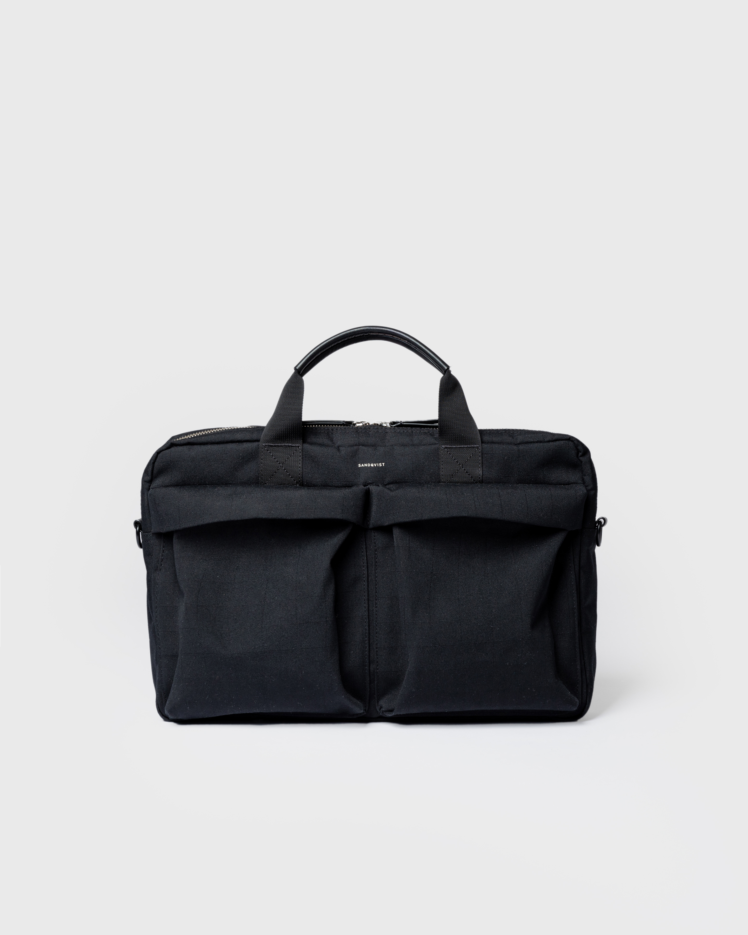 Sandqvist Everyday Briefcase, black. Front view, two handles and and two front pockets. 