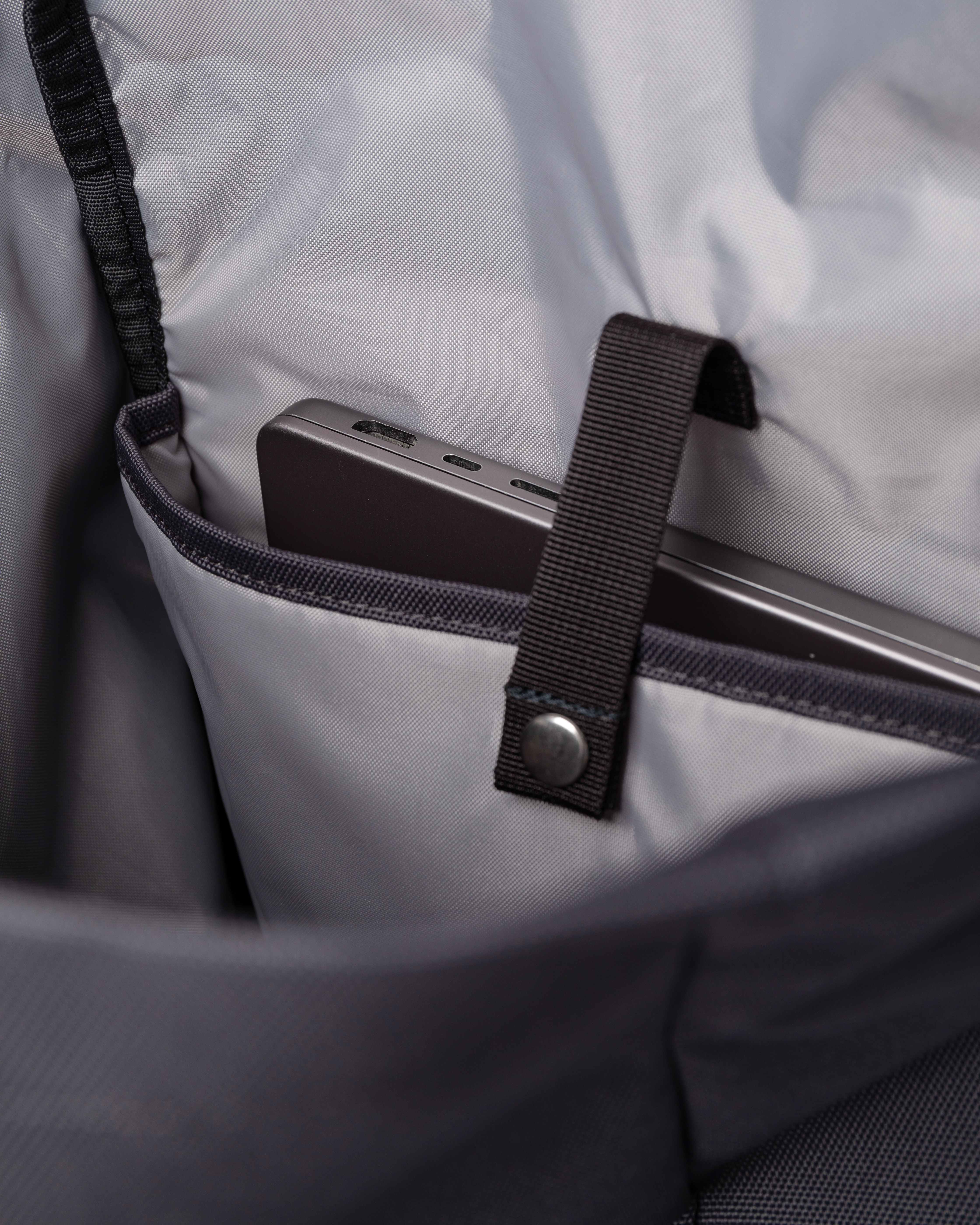 Sandqvist Ground Rolltop Backpack L. Inside view, padded internal laptop sleeve with strap.
