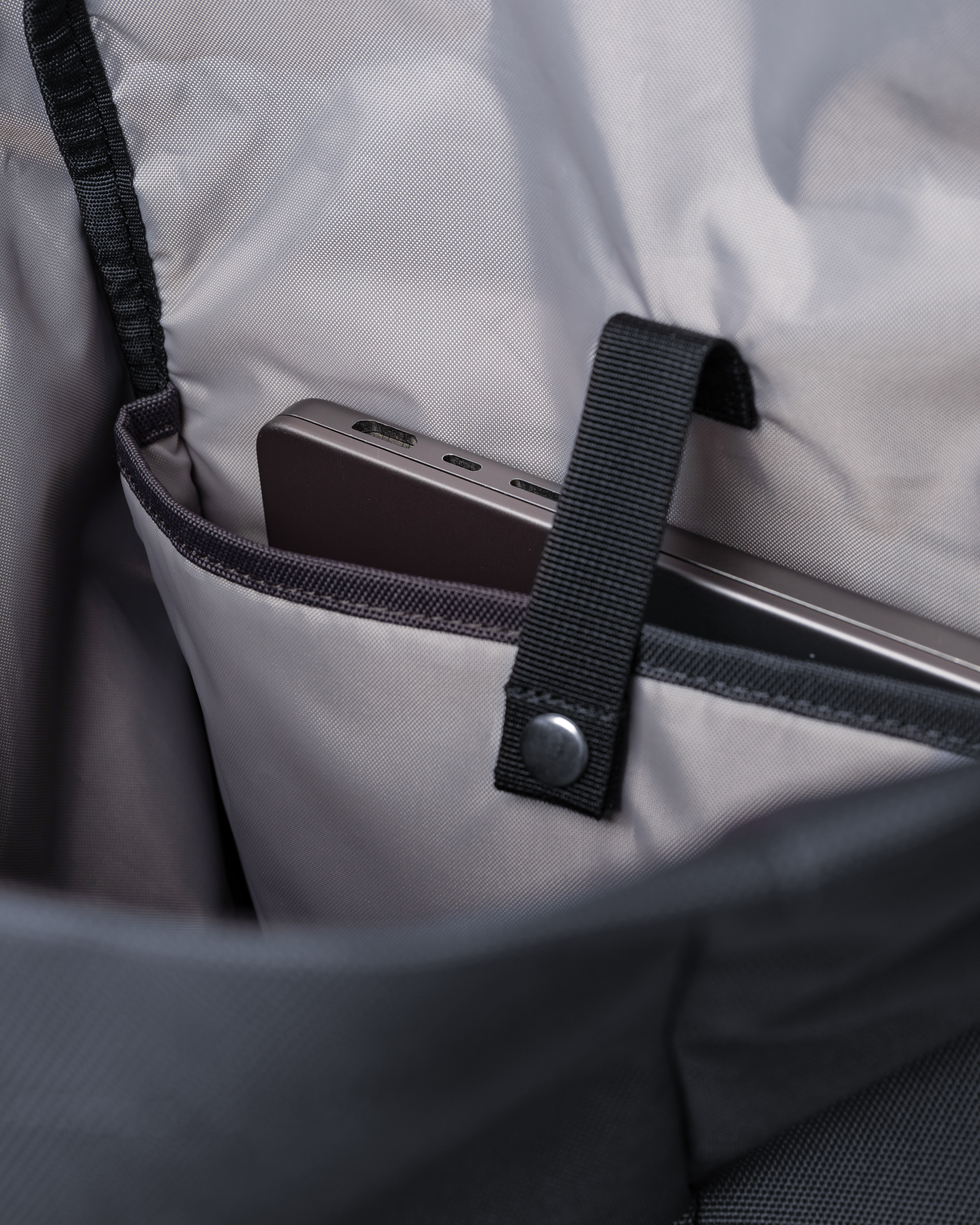 Sandqvist Ground Rolltop Backpack L. Inside view, padded internal laptop sleeve with strap.