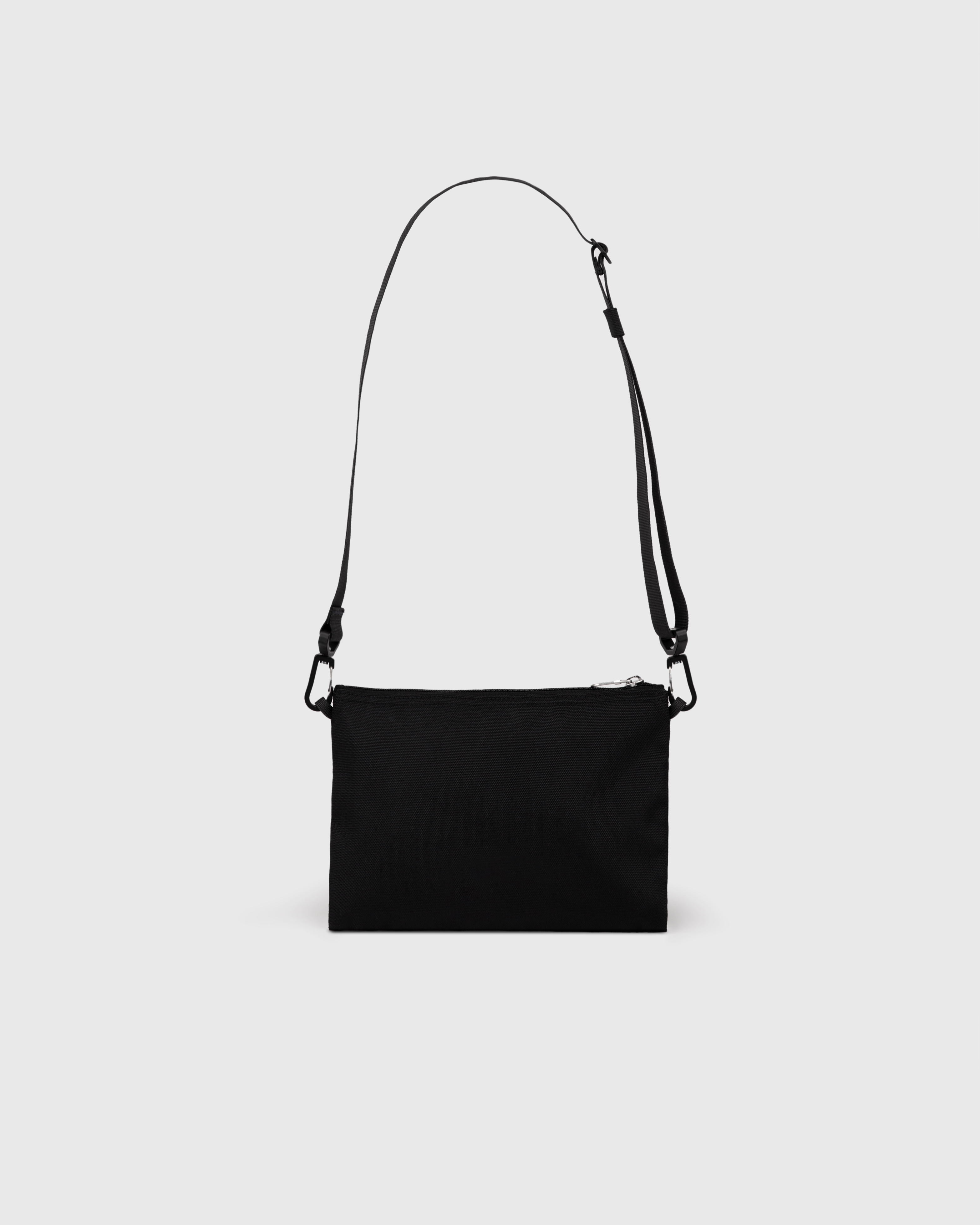 Sandqvist Ground Sacoche Slim, black. Back view, zipper and shoulder strap.