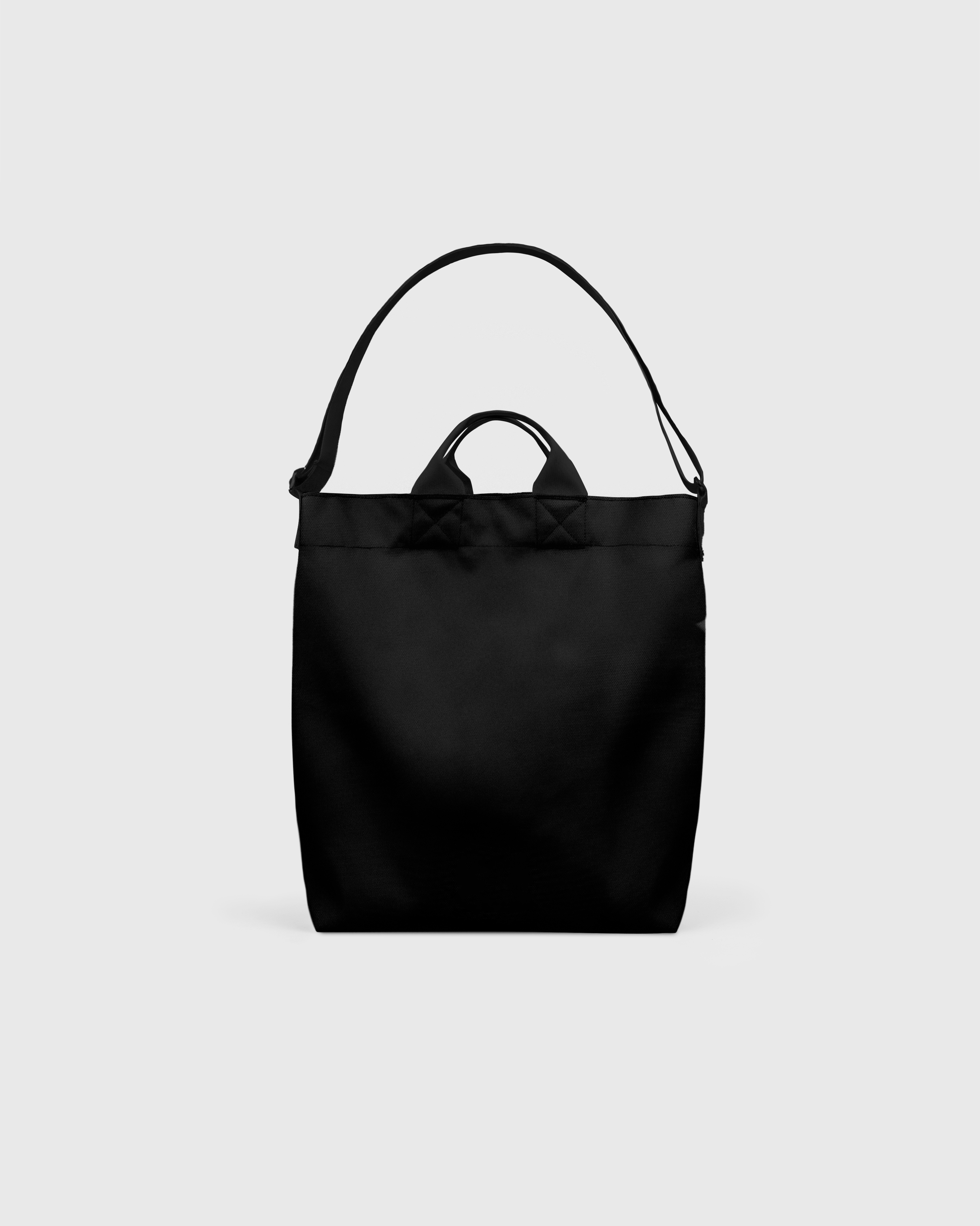 Sandqvist Ground Shopper Bag, black. Back view, handles and shoulder strap.