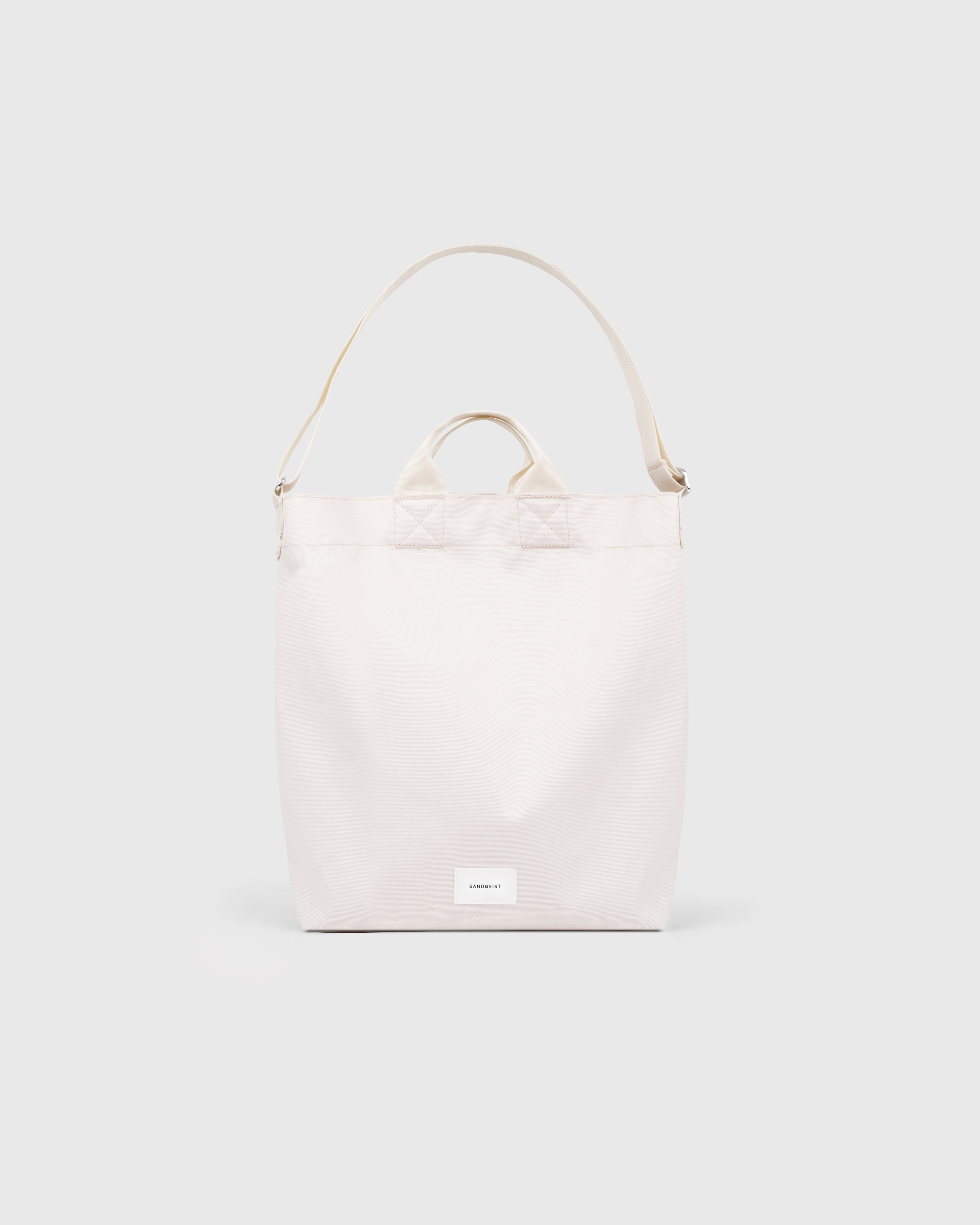 Sandqvist Ground Shopper Bag, white. Front view, handles and shoulder strap.