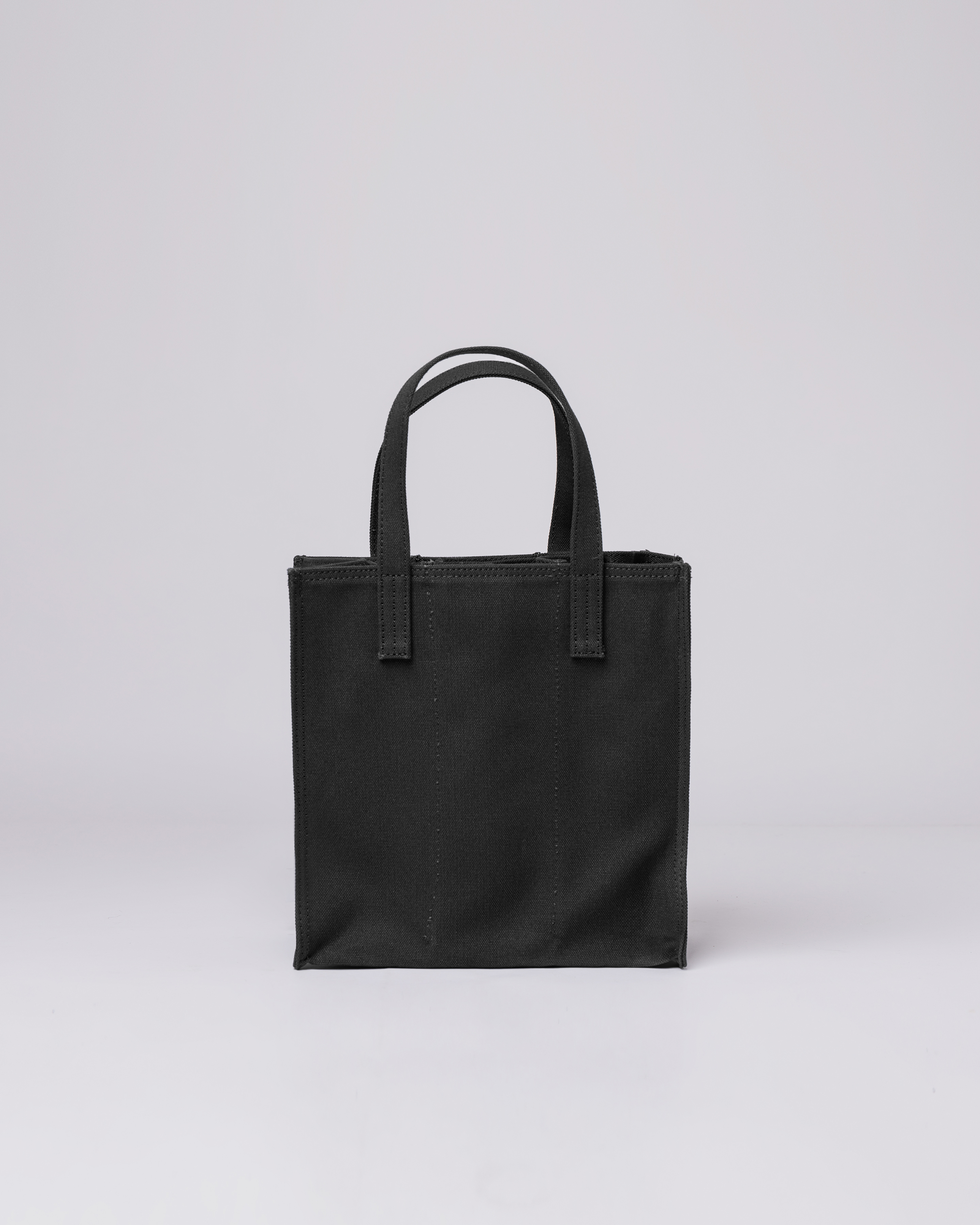 Sandqvist Bottle Bag in Black, back view with top handles. 