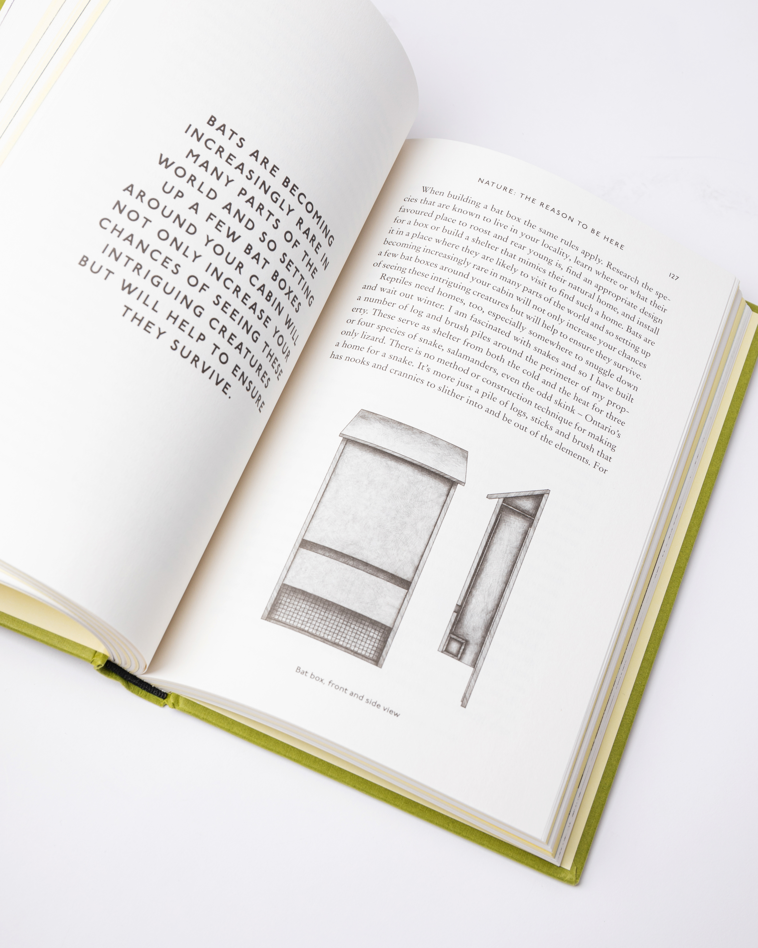 Opened book. Top view of two pages with text from the book Sandqvist Cabin.