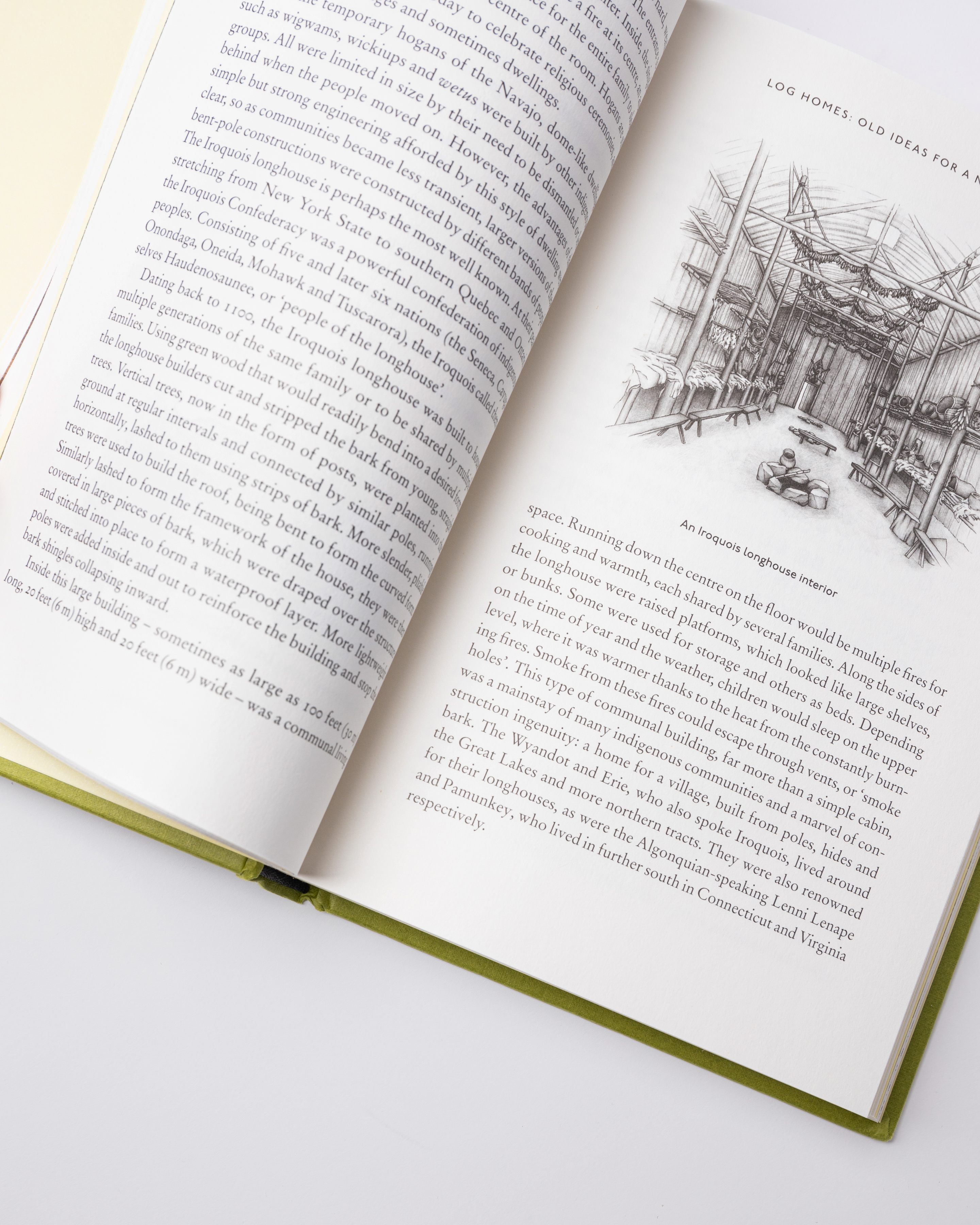 Opened book. Top view of two pages with text from the book Sandqvist Cabin.