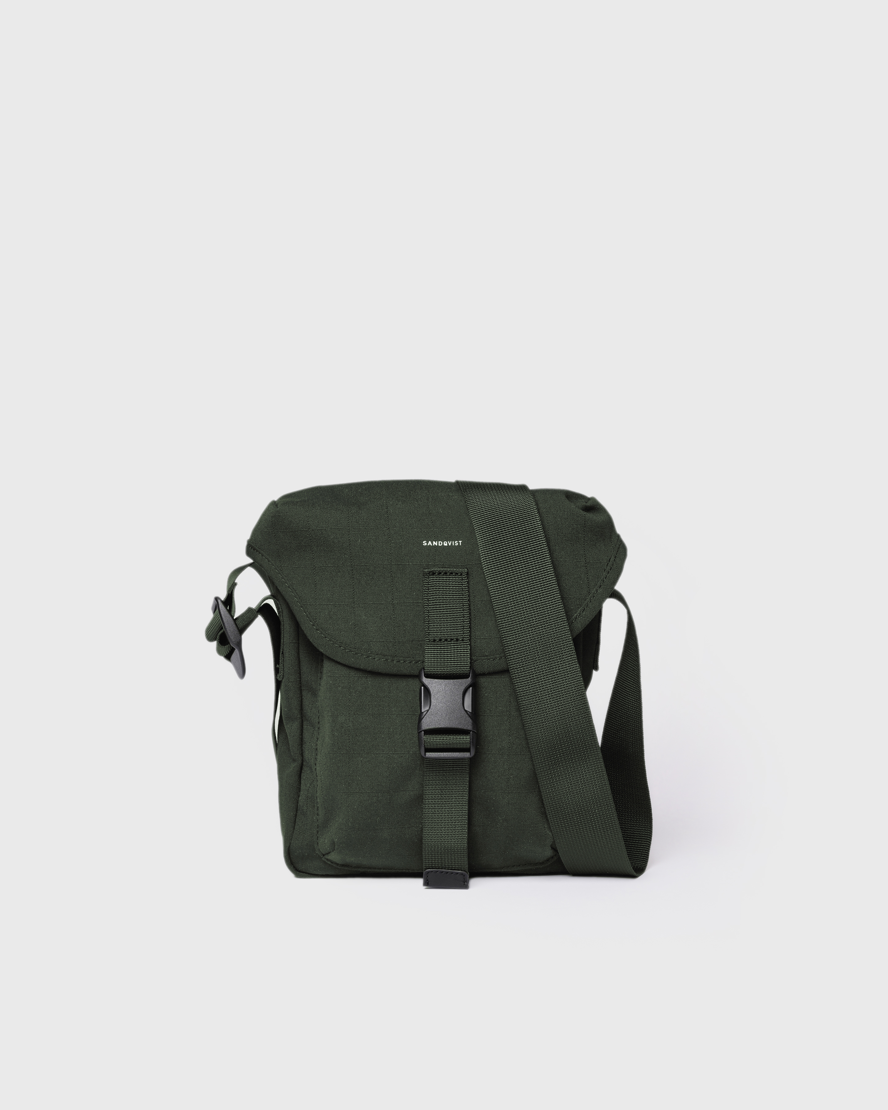 Sandqvist Everyday crossbody bag, green. Front view, lid with buckle closure and shoulder strap.