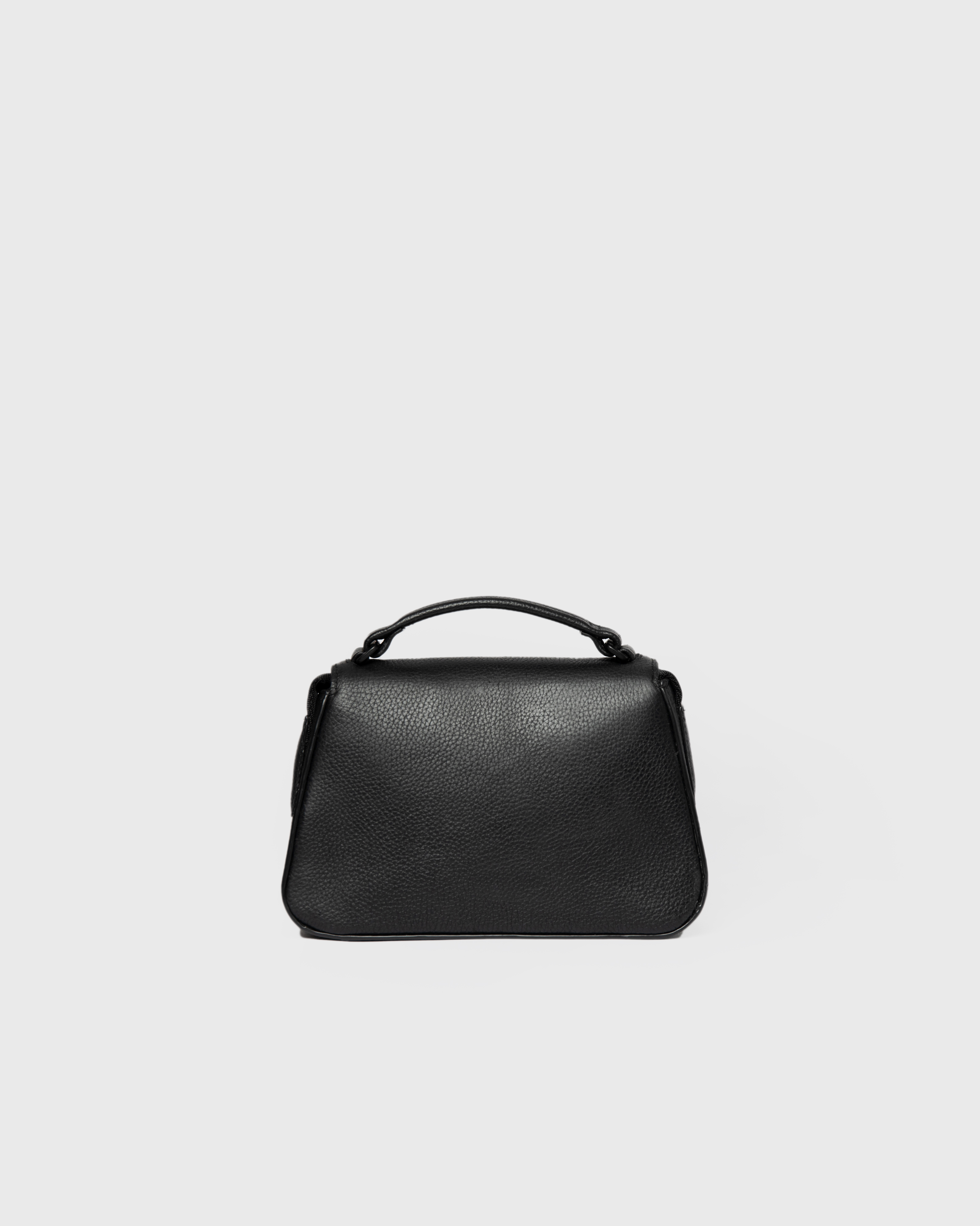 View of the back of the Sandqvist Agile Handle Crossbody Bag, black.