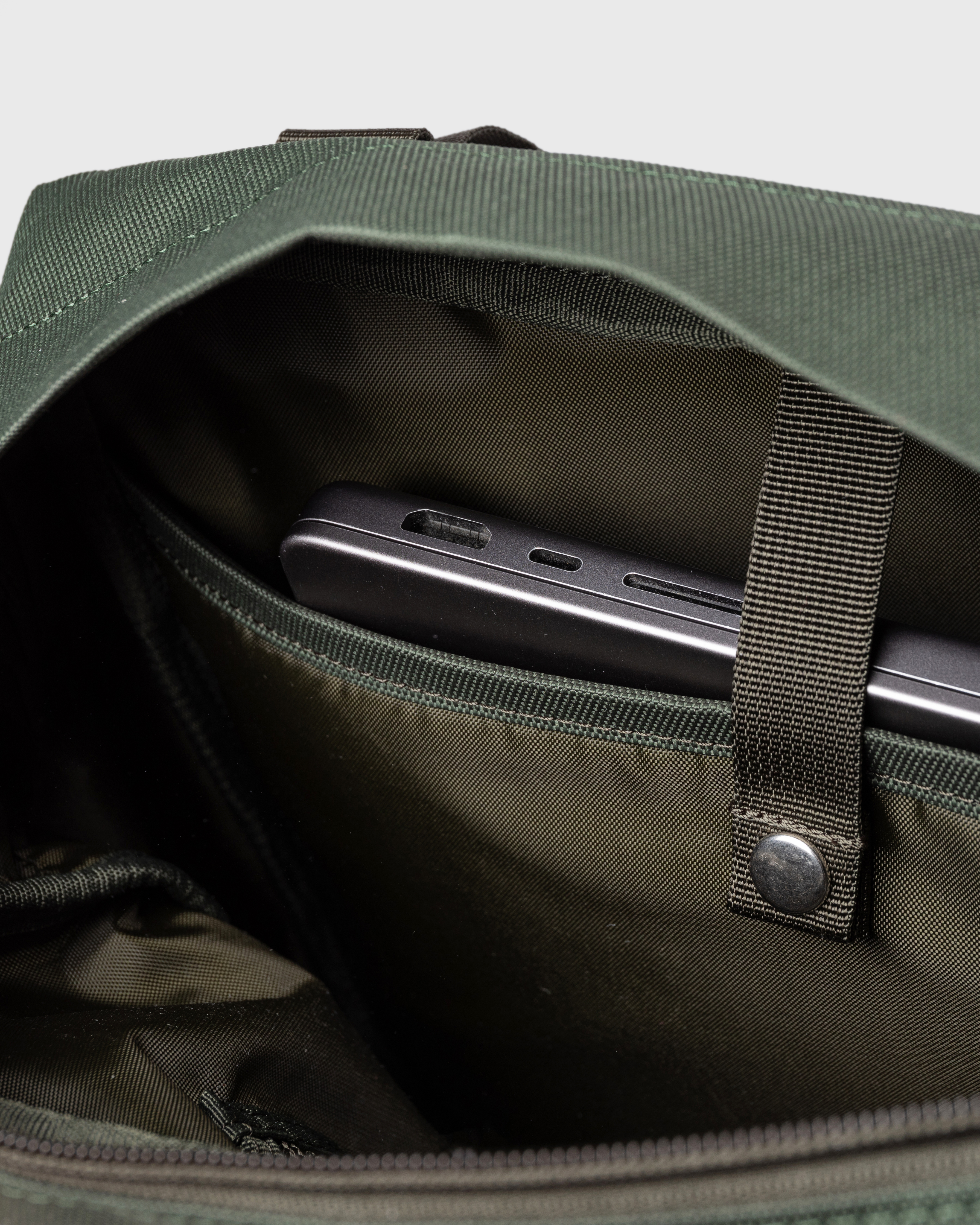 Go 2-way Tote Bag, green. Inside view, inner laptop compartment with snap button.