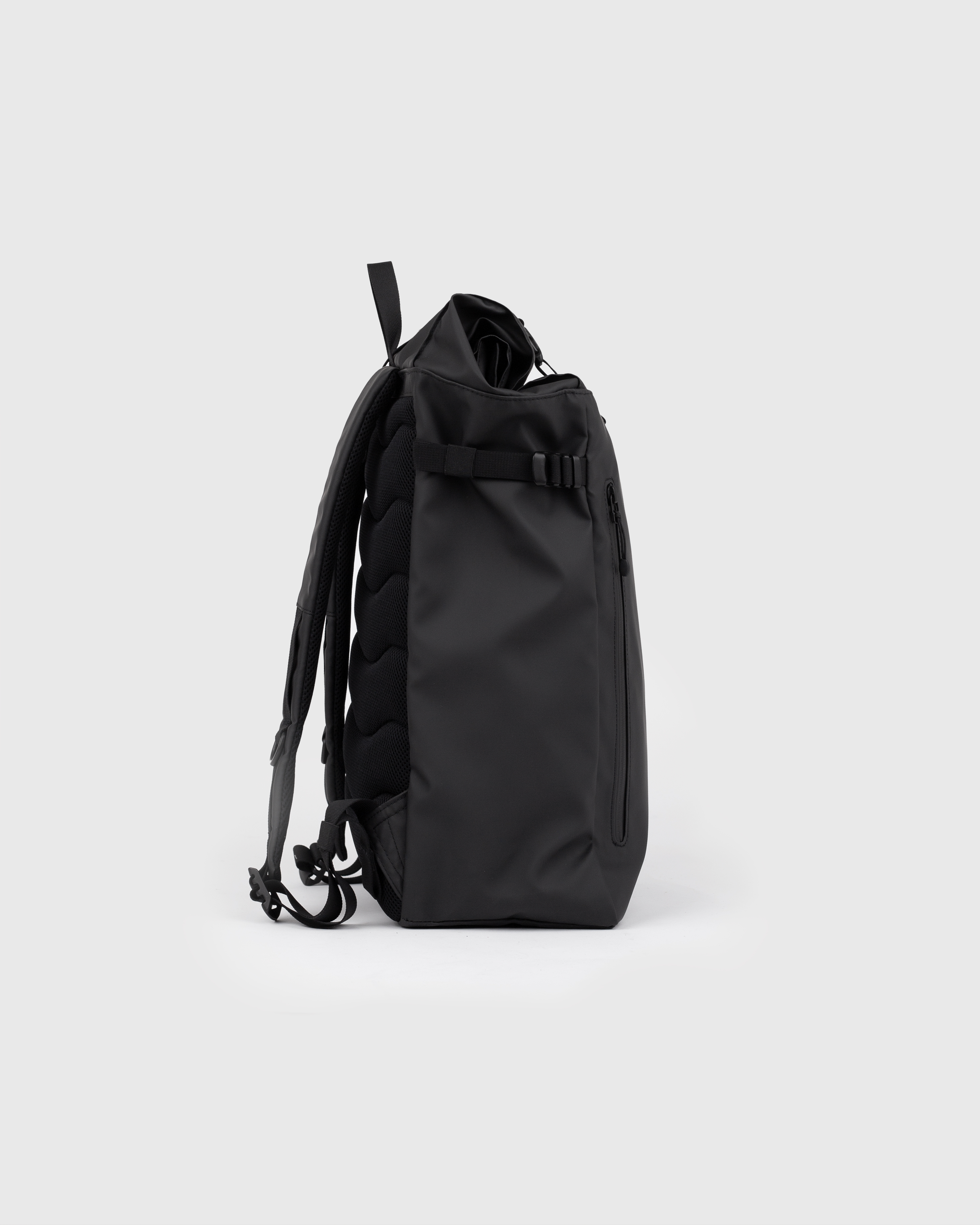 Sandqvist STREAM Slim Rolltop L backpack in black, side view with shoulder, top handle straps and rolltop closure.