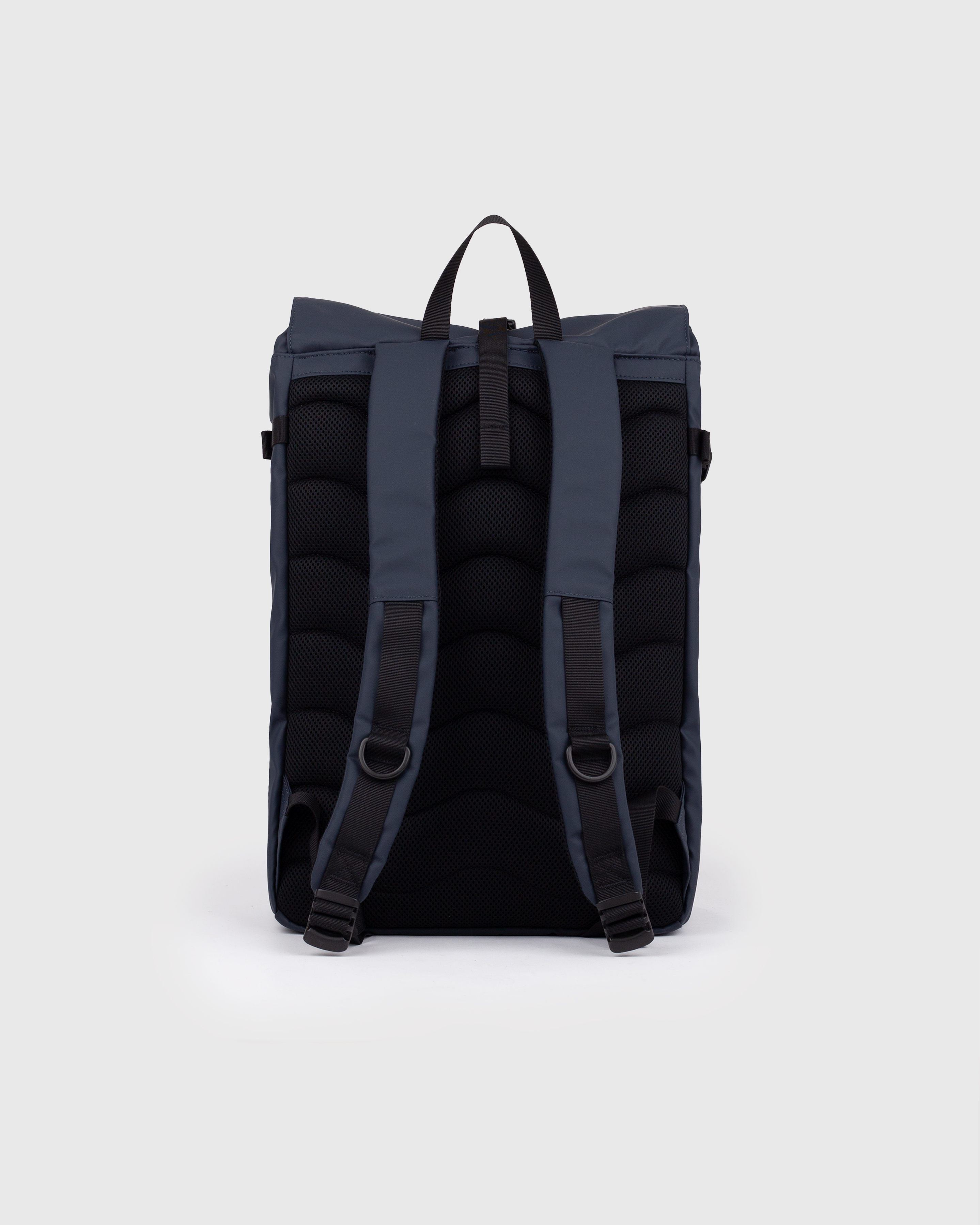 Sandqvist STREAM Slim Rolltop L backpack in navy, back view with shoulder straps and roll-top closure.
