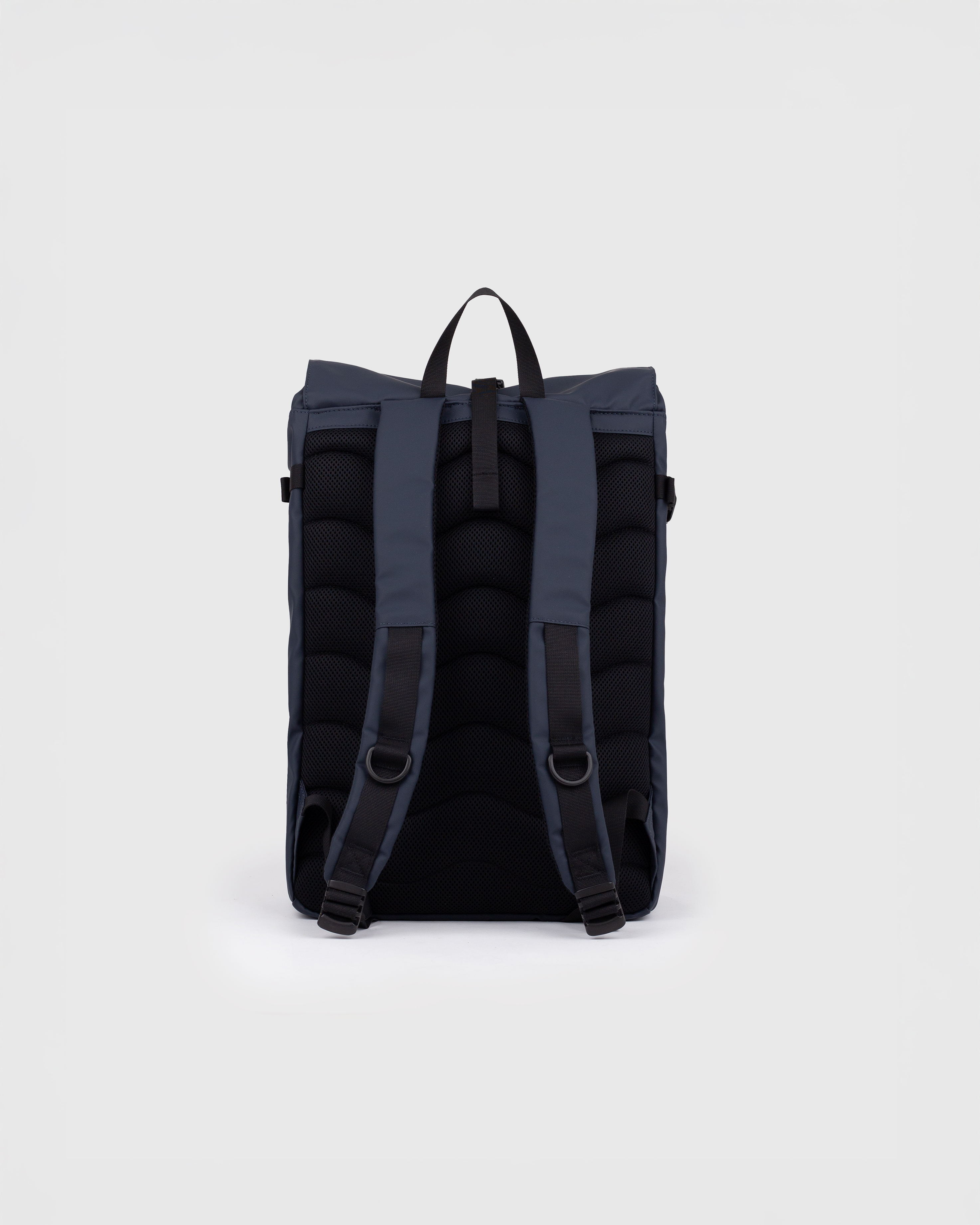Sandqvist STREAM Slim Rolltop M backpack in navy, back view with shoulder straps and roll-top closure.