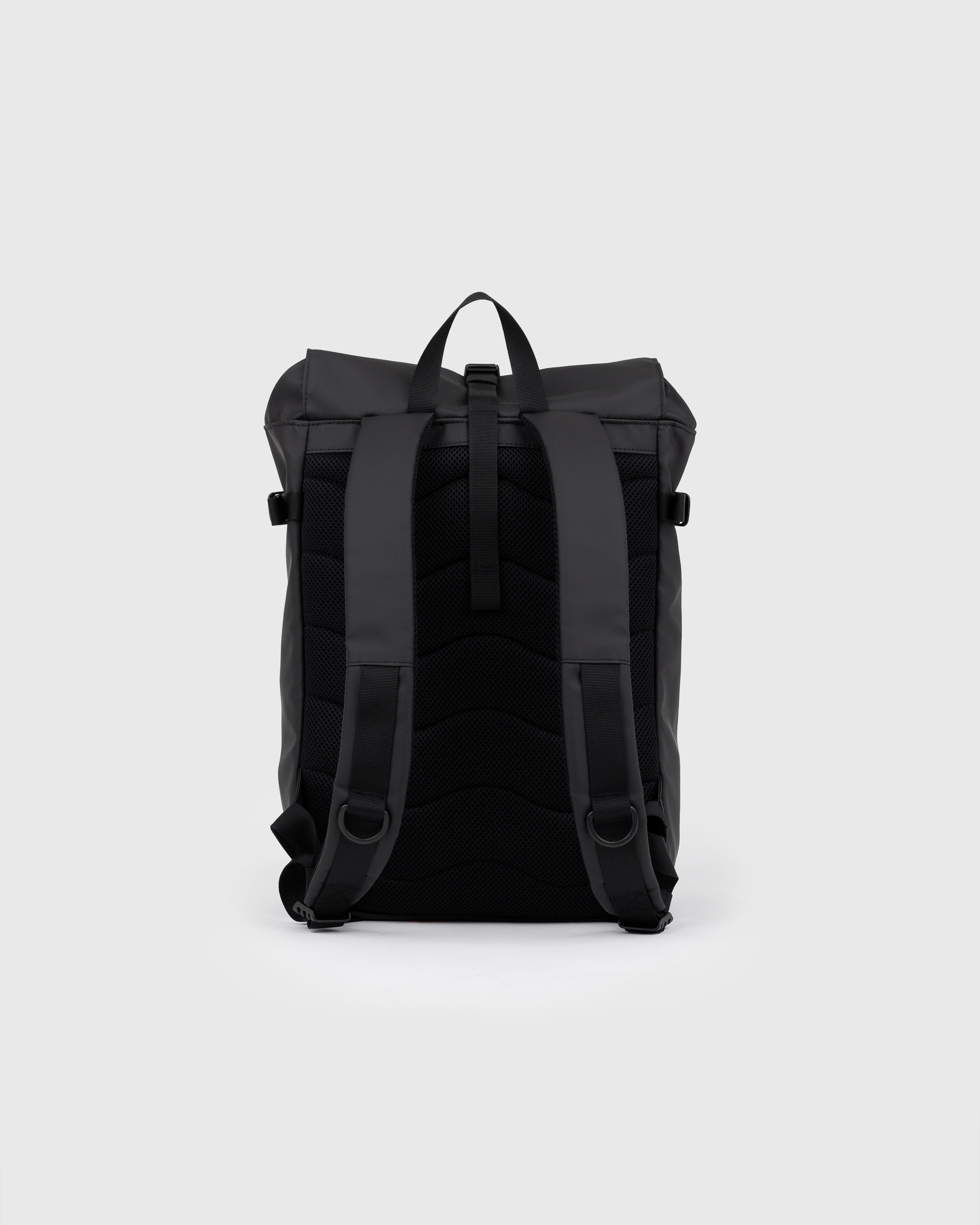 Sandqvist STREAM Slim Rolltop M backpack in black, back view with shoulder straps and roll-top closure.