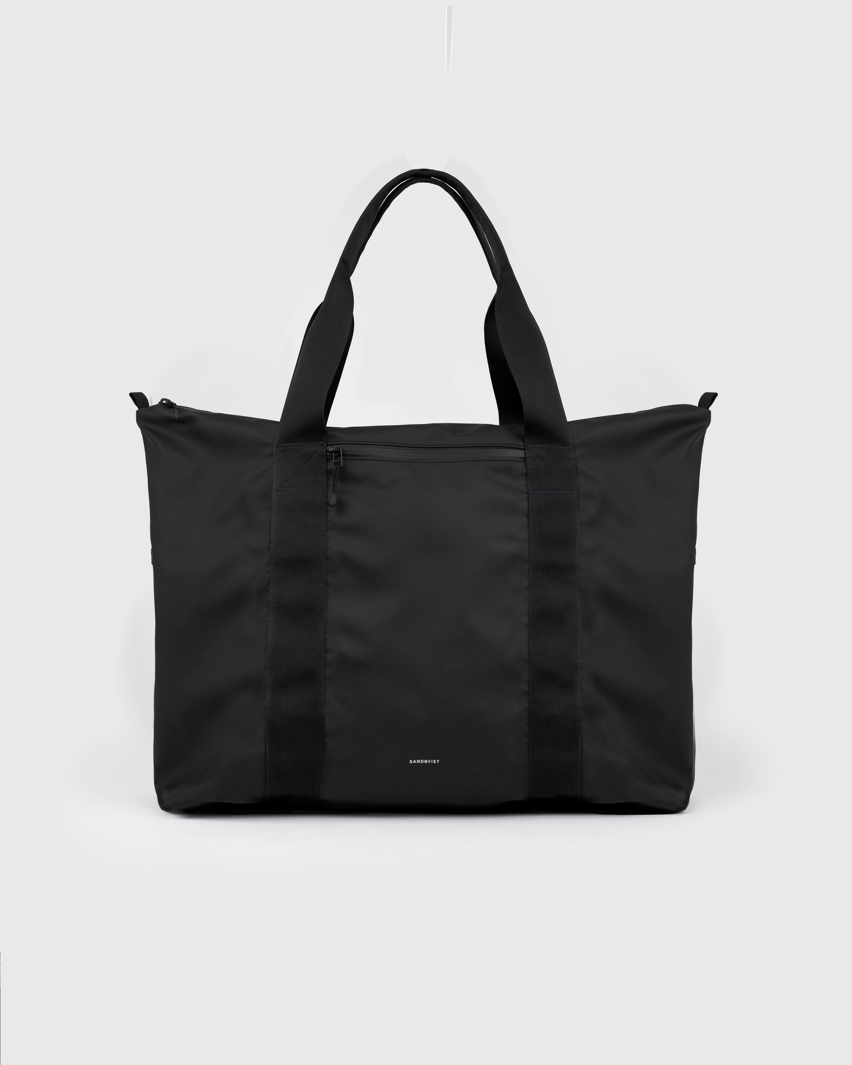 Sandqvist STREAM Weekender Bag, black, front view with top handles and zipper pocket.