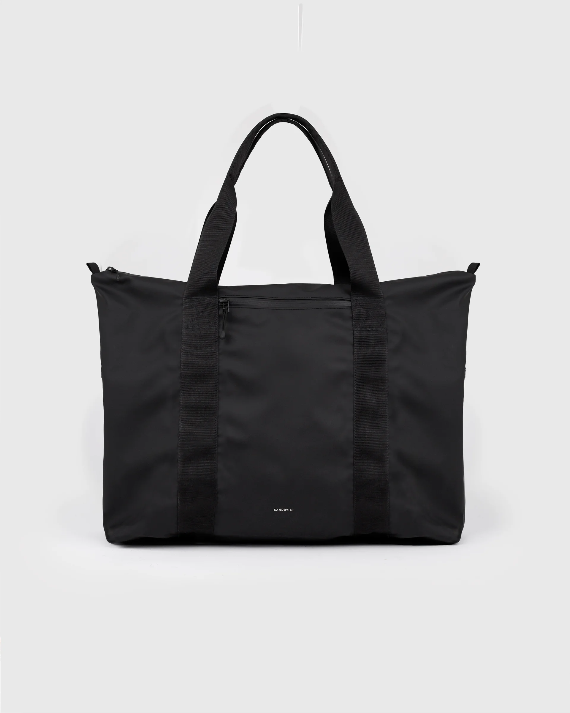 Sandqvist STREAM Weekender Bag, black, front view with top handles and zipper pocket.