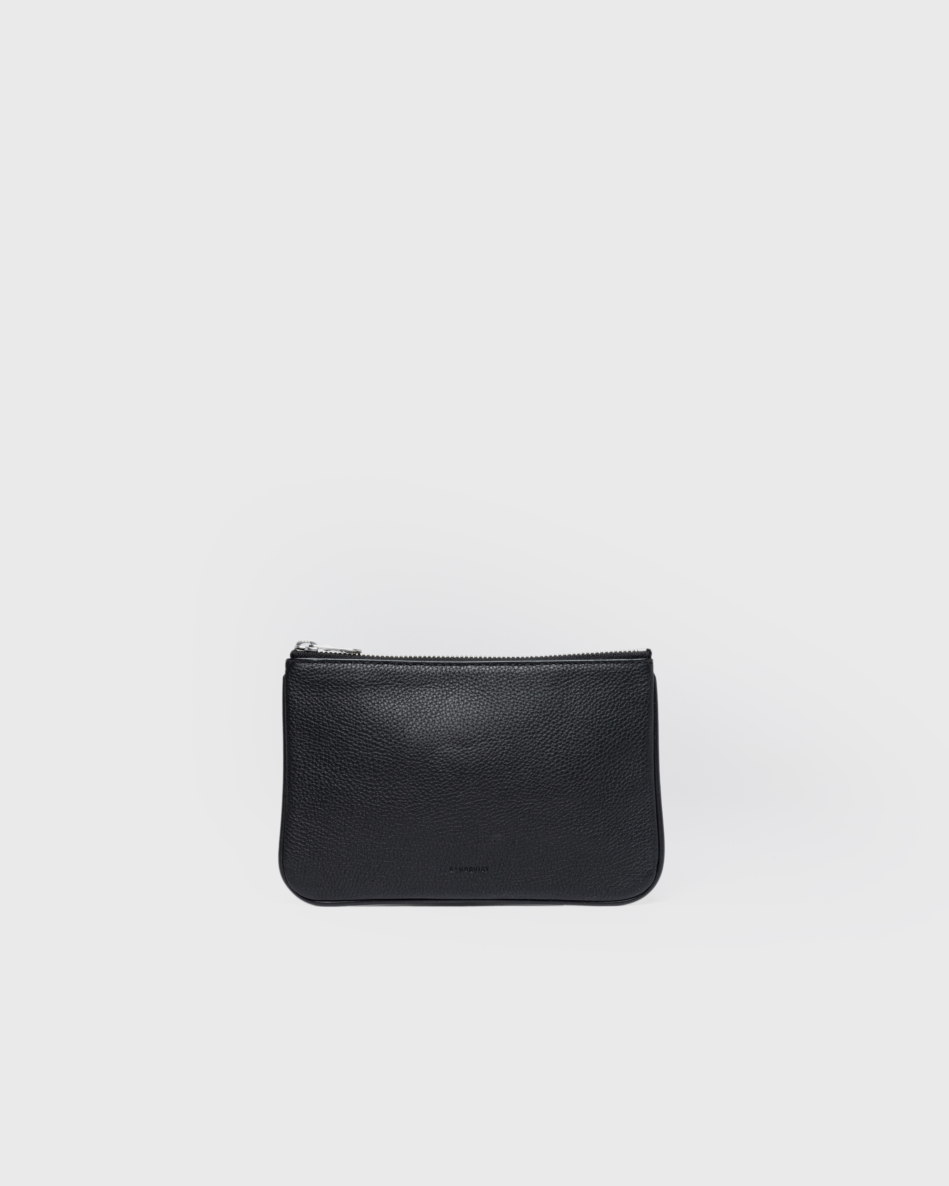 Front view of the Sandqvist LEATHER Pouch in black with zippered main compartment with Sandqvist brand logo.