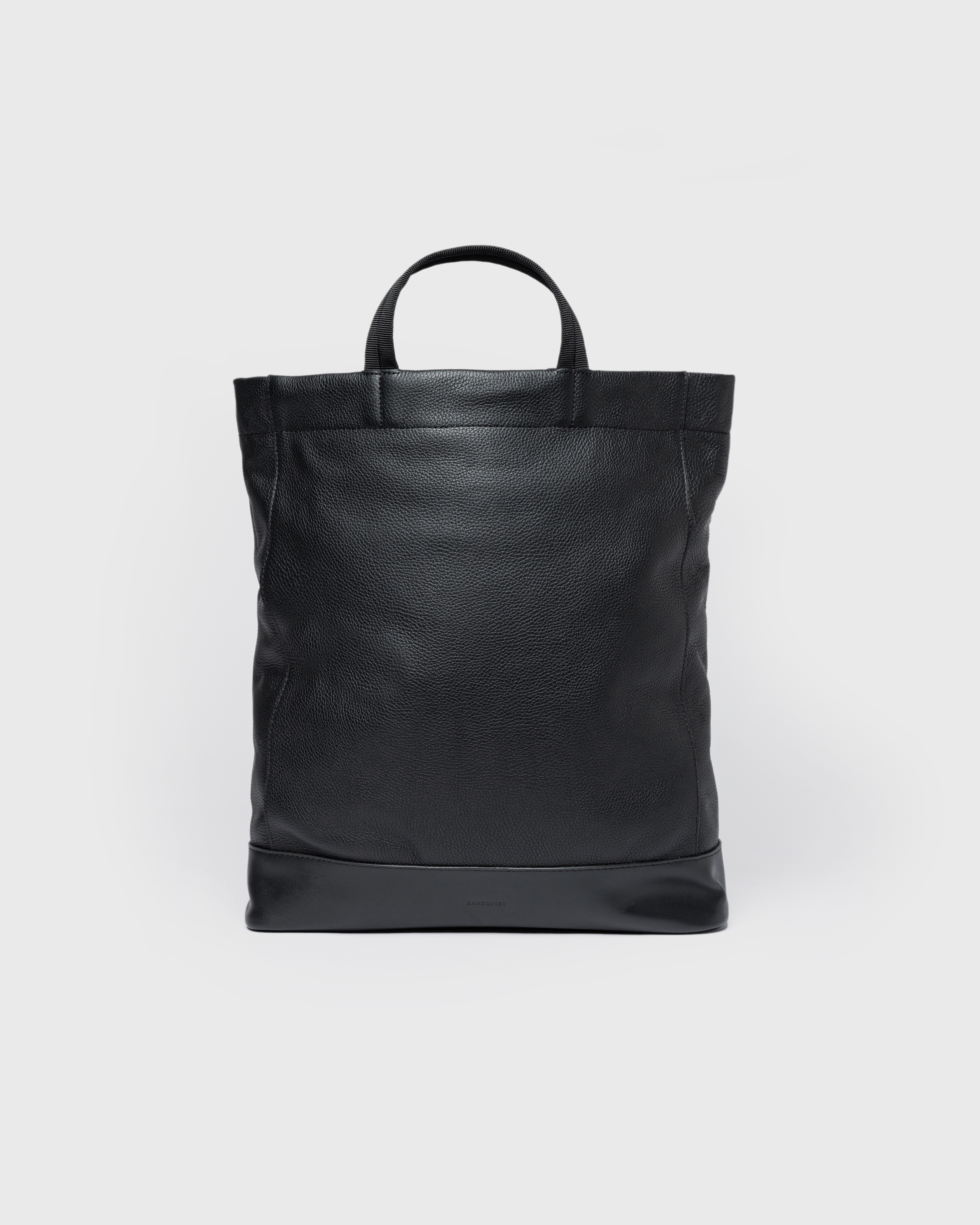 Sandqvist Backpack LEATHER Tote Backpack in black, front view with top handle.