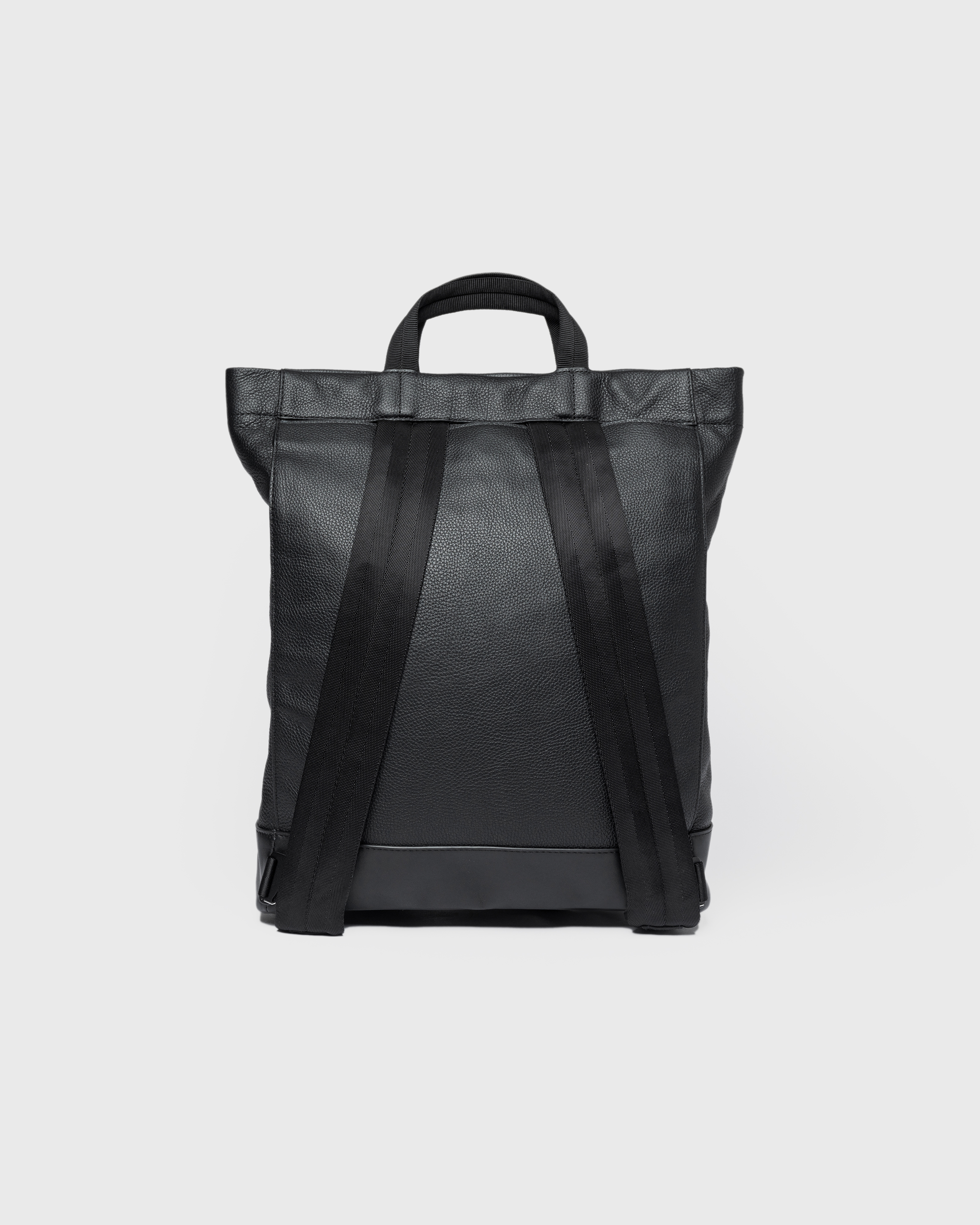 Sandqvist Backpack LEATHER Tote Backpack in black, backview view with top handles and shoulder straps.
