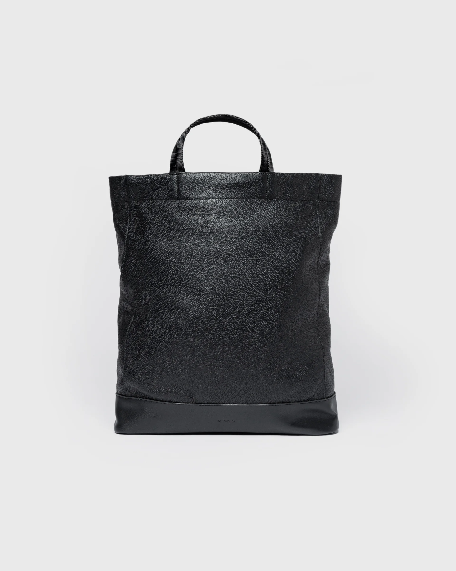 Sandqvist Backpack LEATHER Tote Backpack in black, front view with top handle.