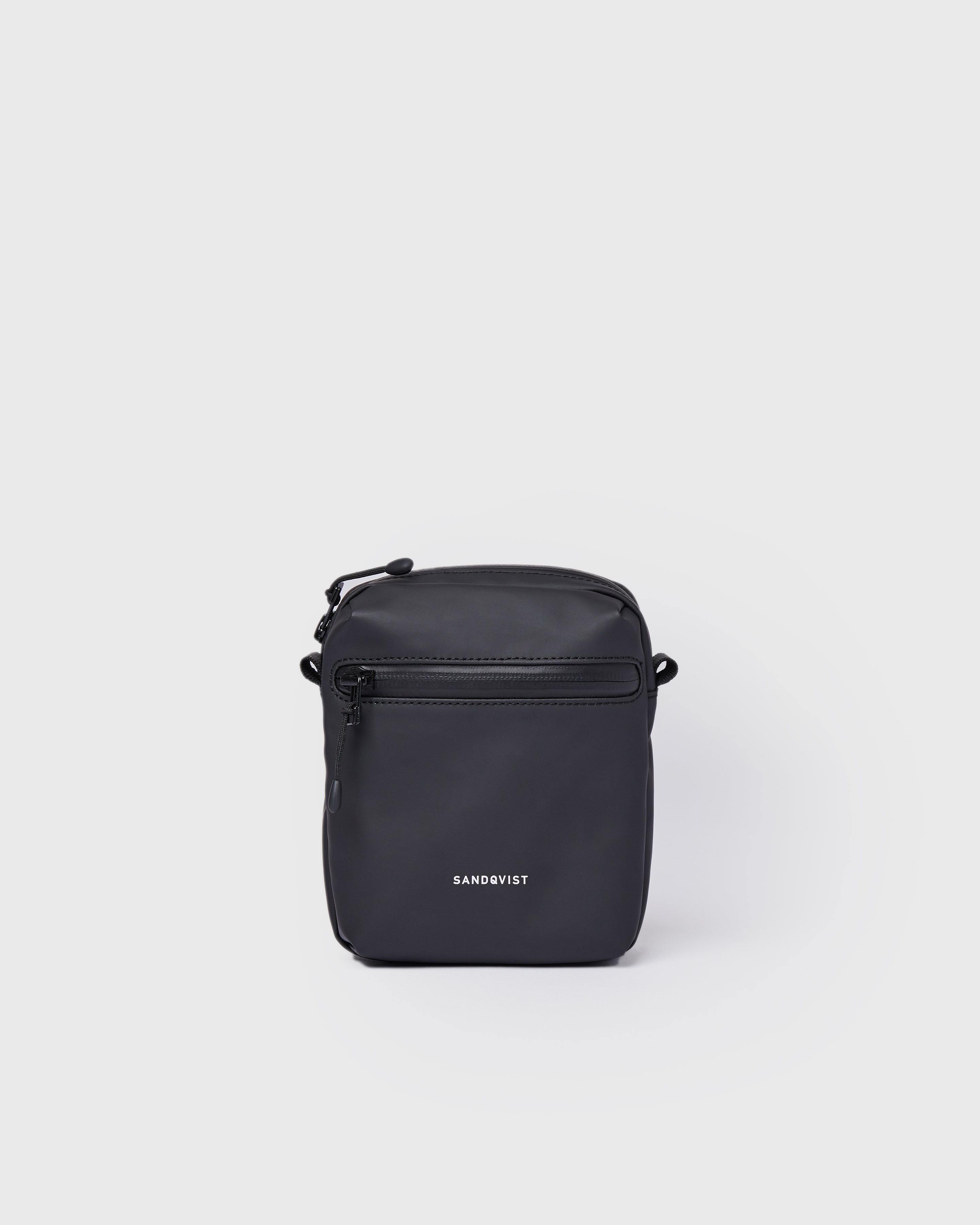 Sandqvist Shoulder Bag Poe in black, front view with front zipper pocket.