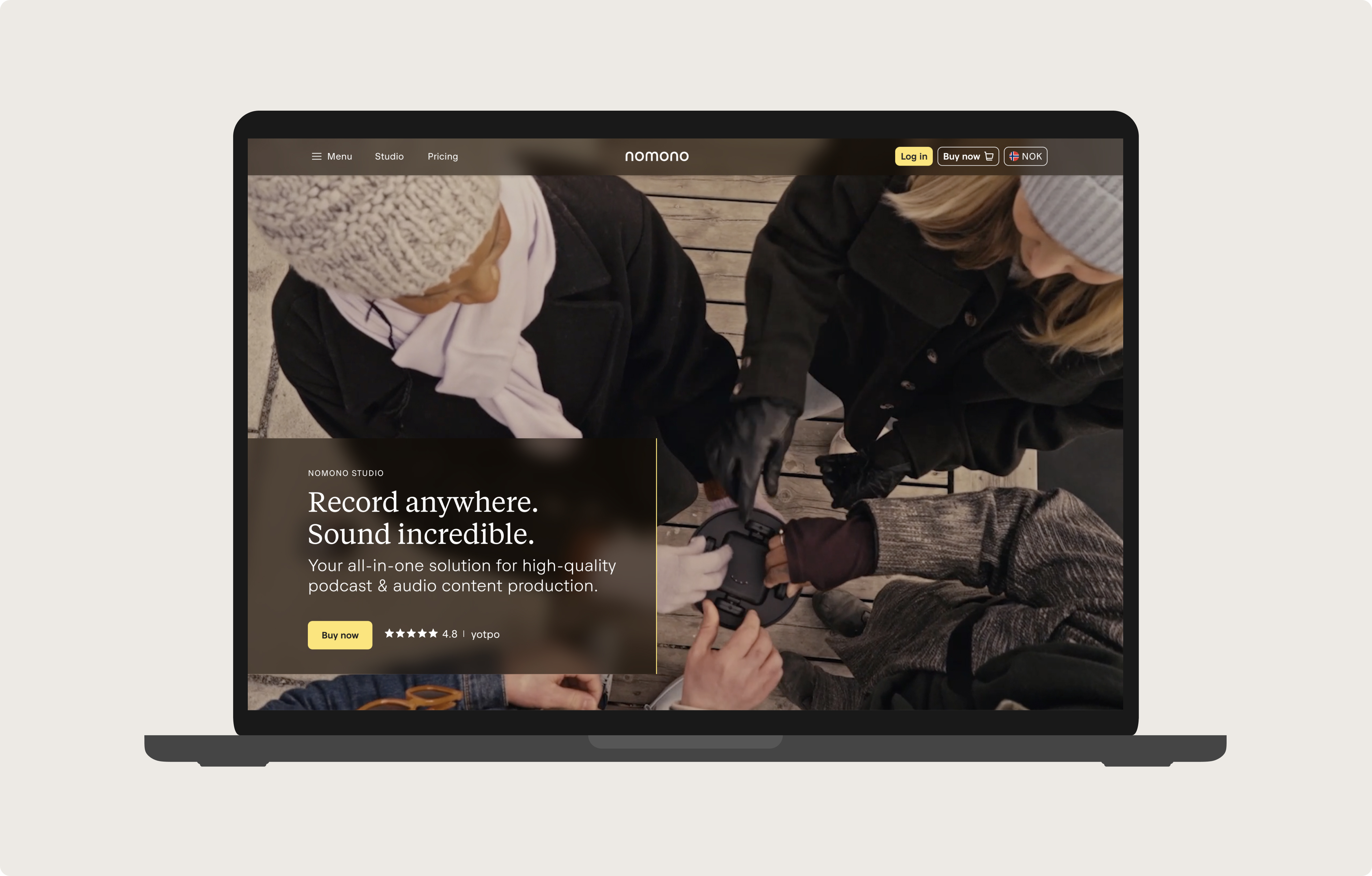 Hero image representing the updated Nomono website on a laptop, featuring people using the product, text, and links