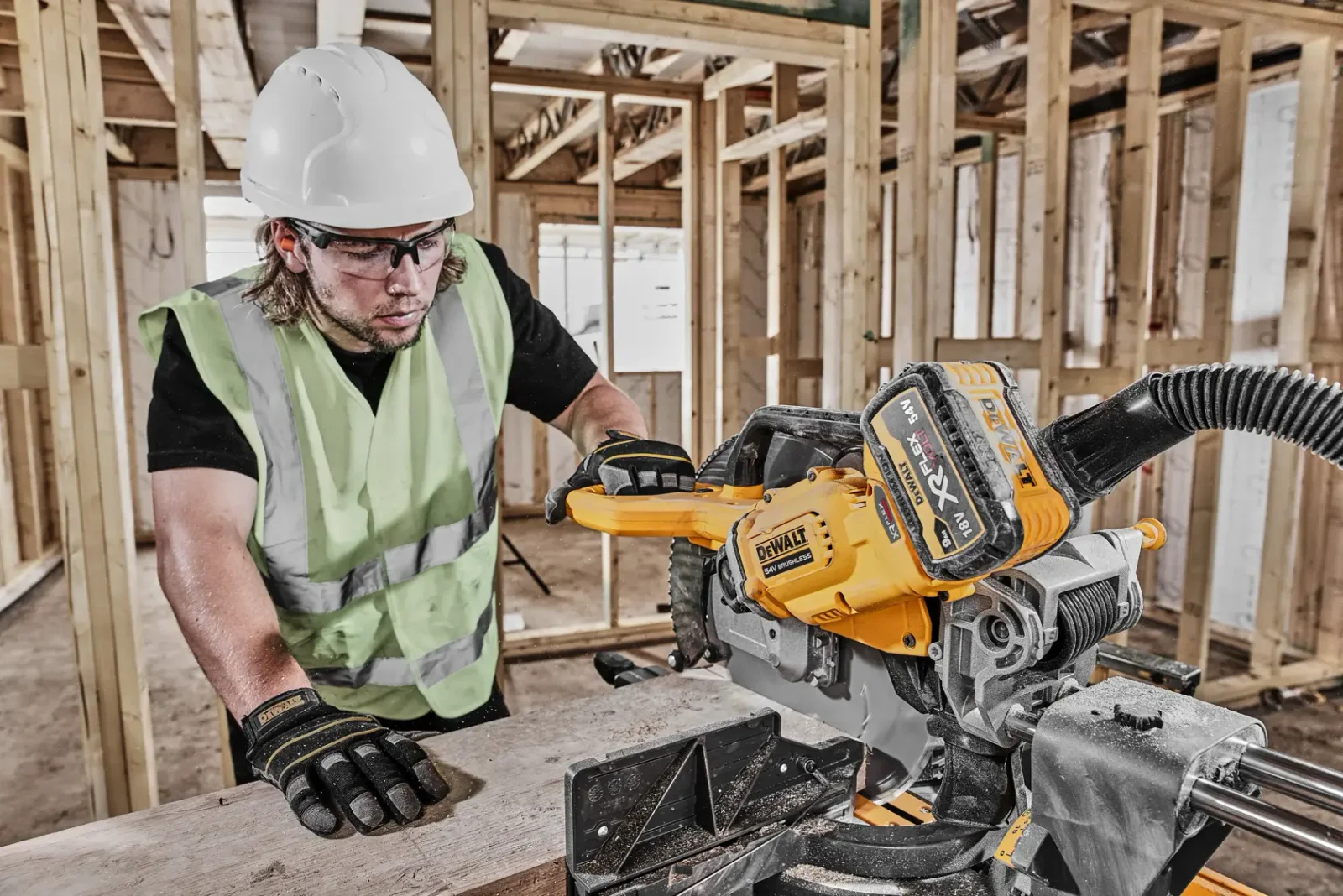 DeWalt DCS781 mitre saw in use on site