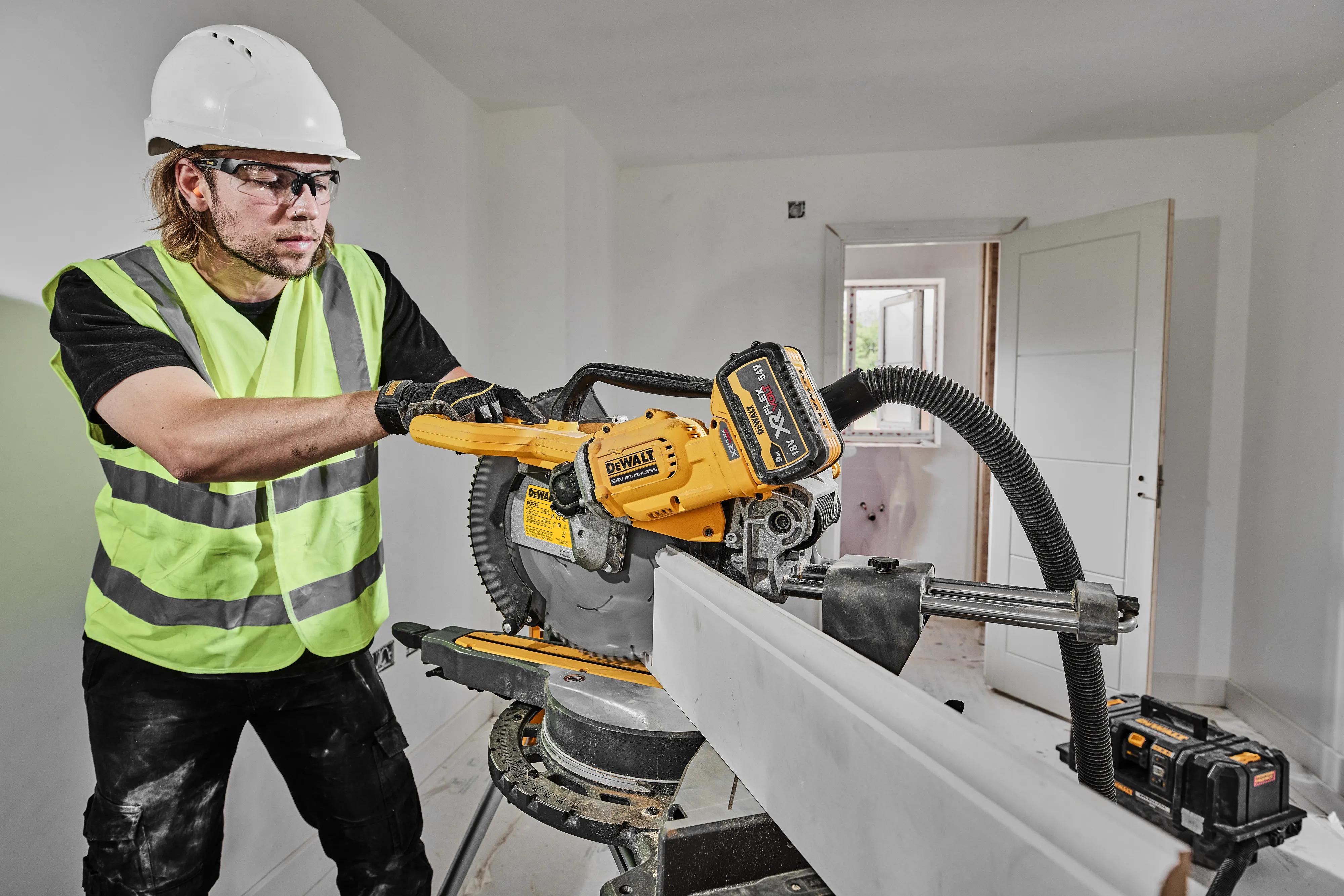 DeWalt DCS781 mitre saw in use on site
