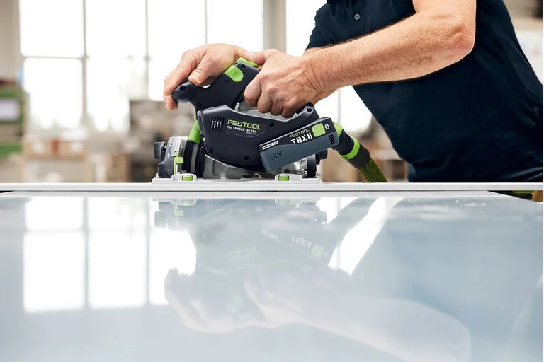 Festool TSC 55 KS cutting a panel on a guide rail