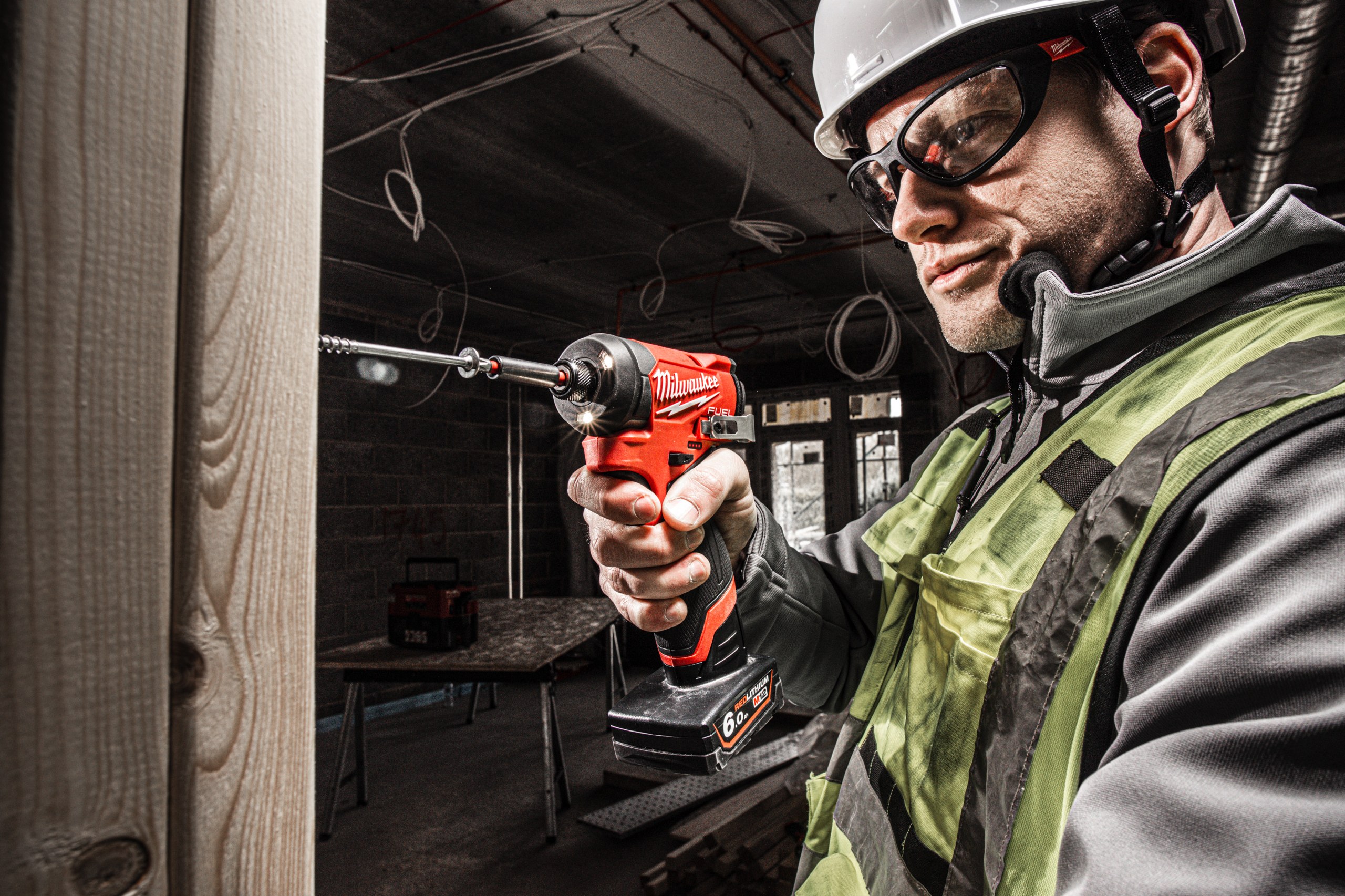 M12 FID2 FUEL Sub-Compact 1/4″ Impact Driver in use on the job