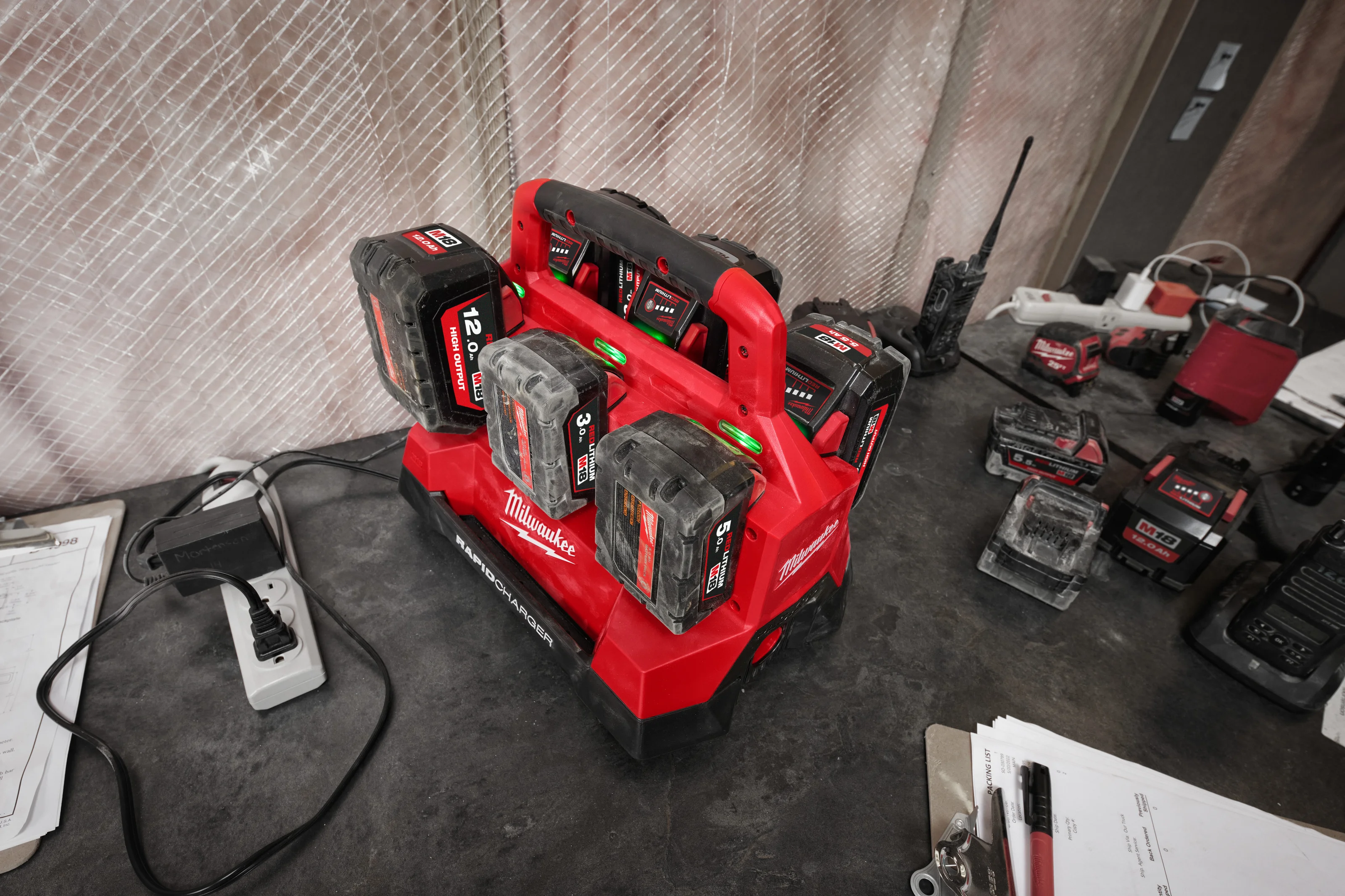 M18 PC6 PACKOUT Six Bay Rapid Charger in use on the job
